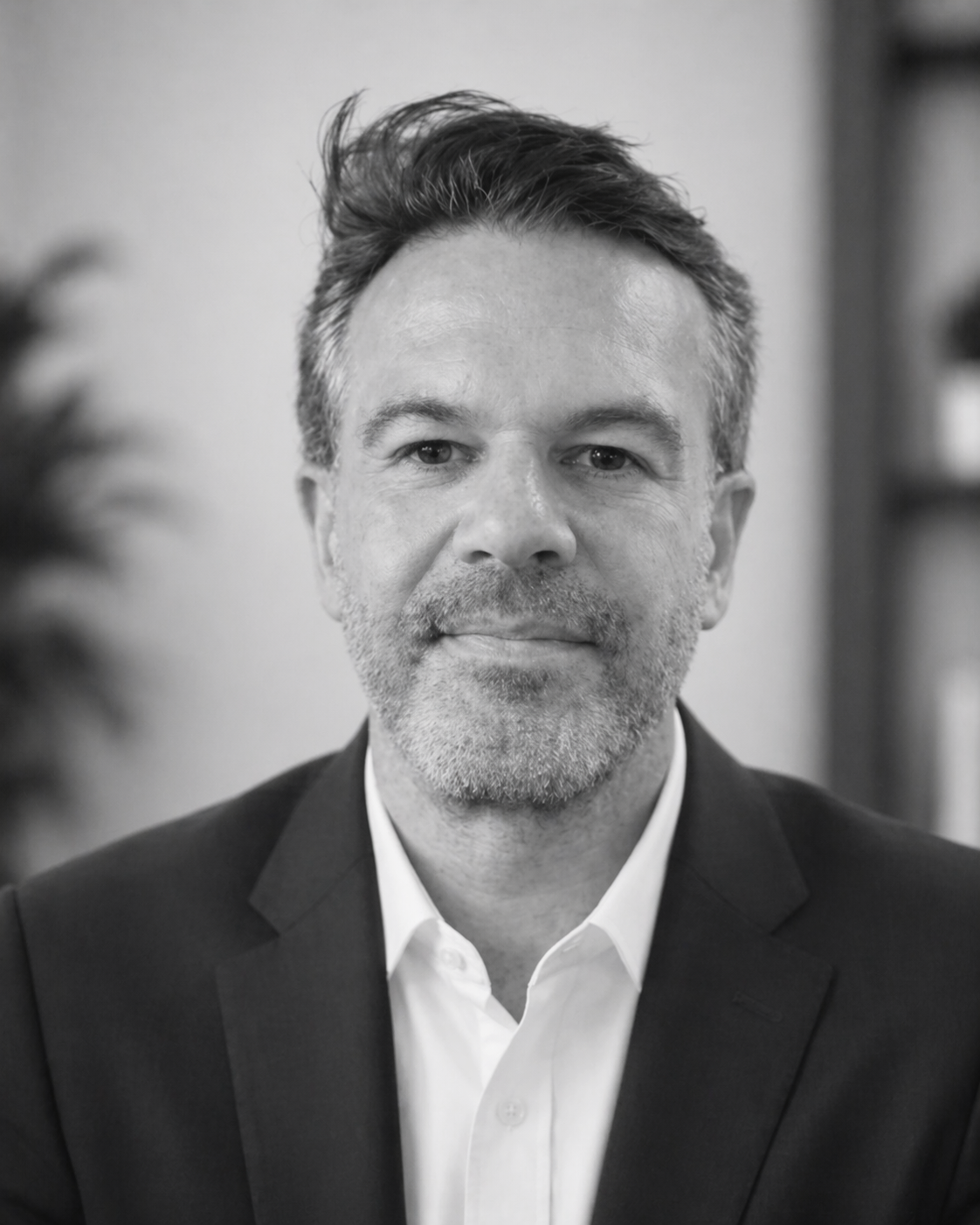 Image of a formal bearded man part of the Becklow Estates Team in Black & White