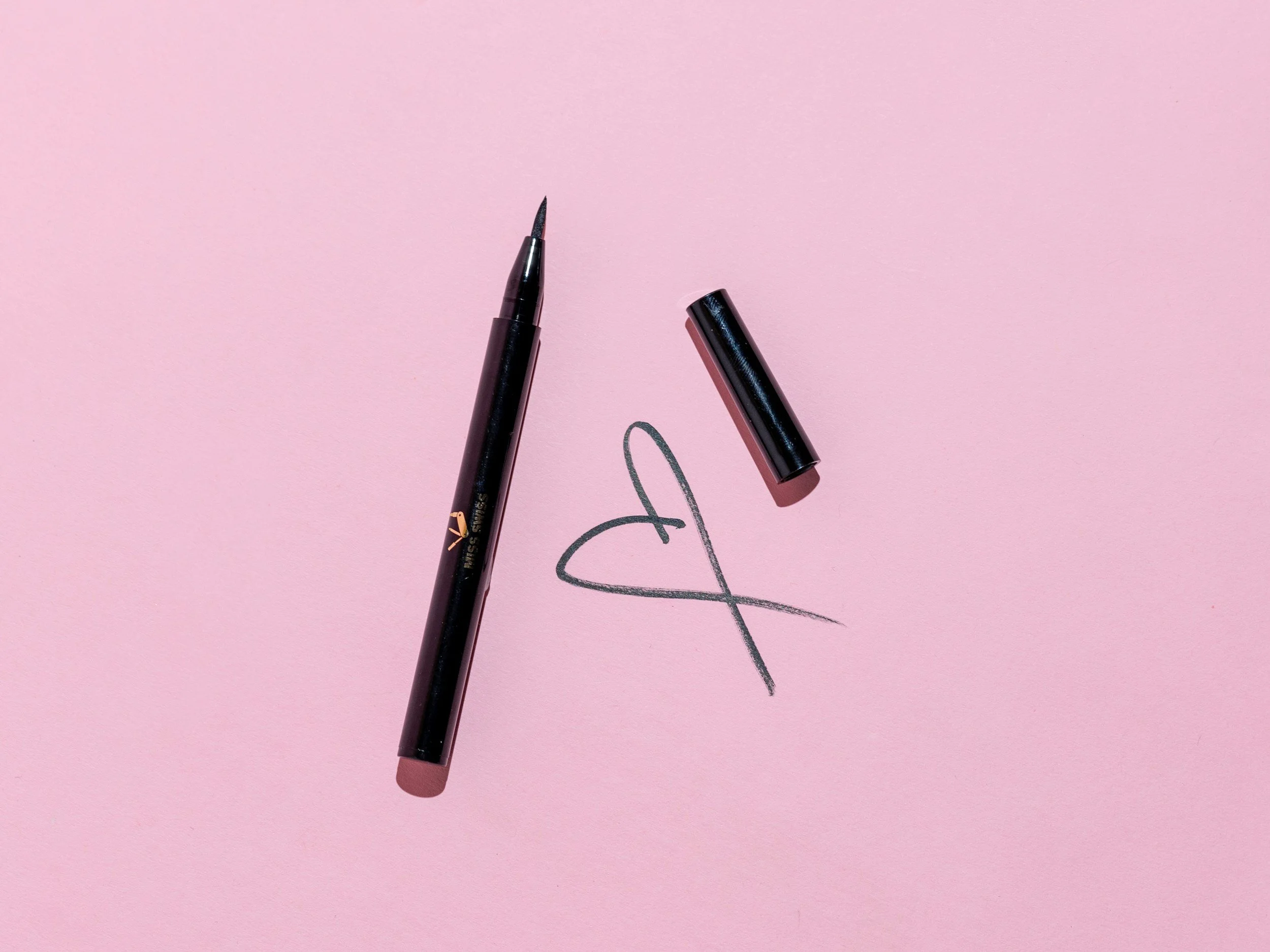 An eyeliner pencil next to a heart that it has drawn. Image courtesy of Ashley Piszek through unsplashed @missswiss