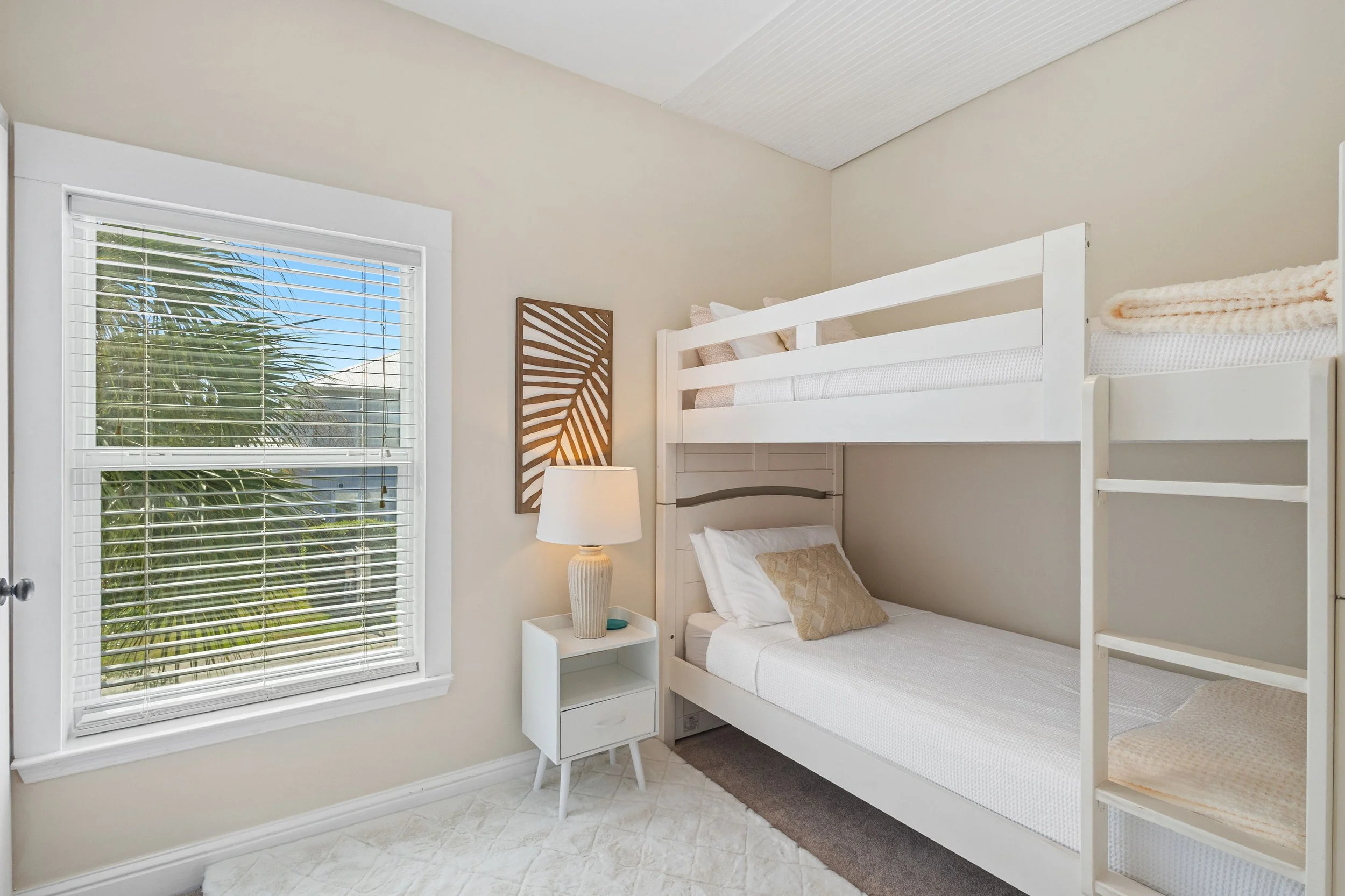 Fun bunk room at Salty Surf on 30A with cozy beds, playful coastal decor, and space for kids to settle in after a beach day.