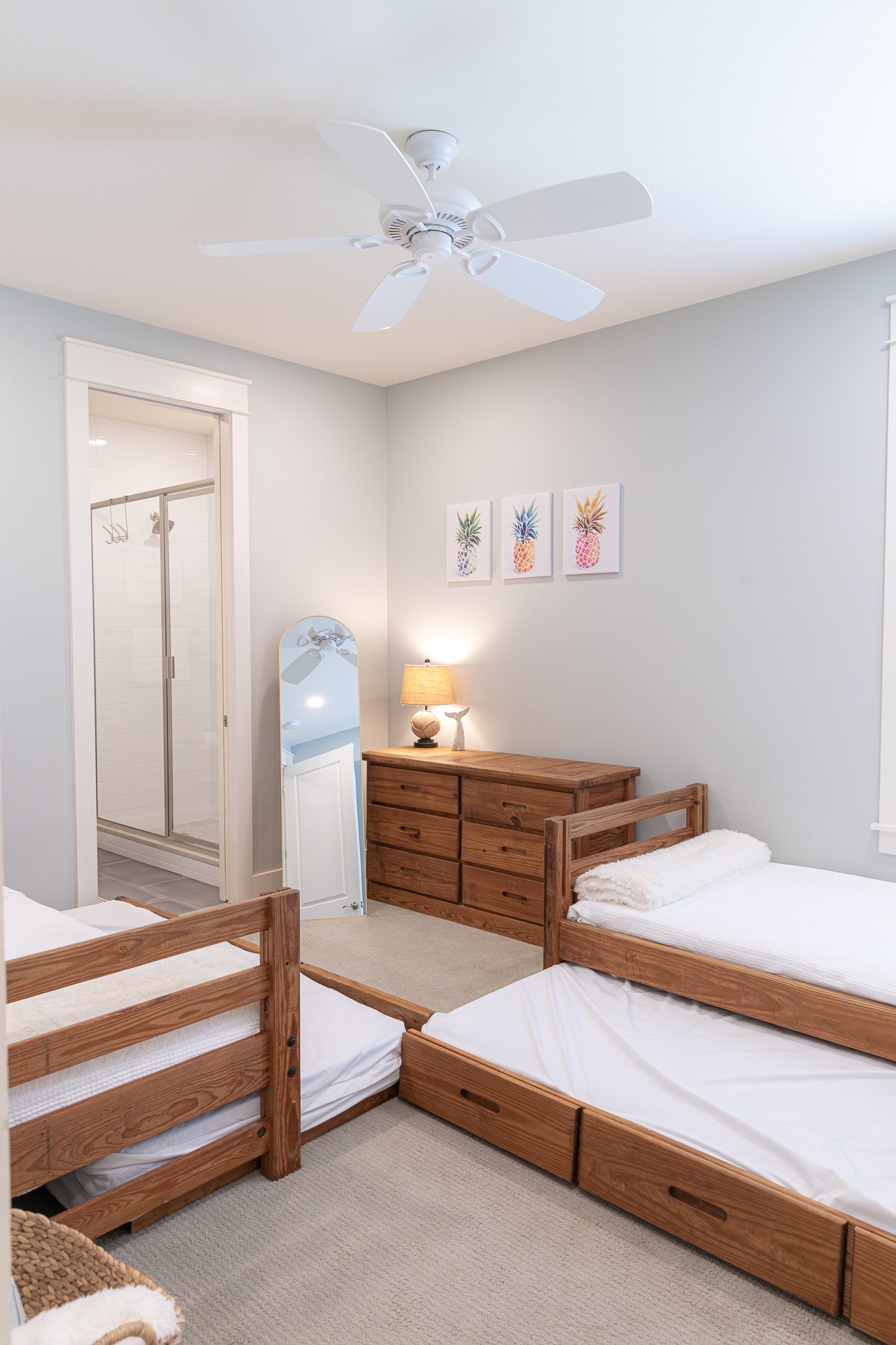 Twin trundle bedroom at Second Set on 30A with four cozy beds, playful coastal decor, and space for kids or extra guests.