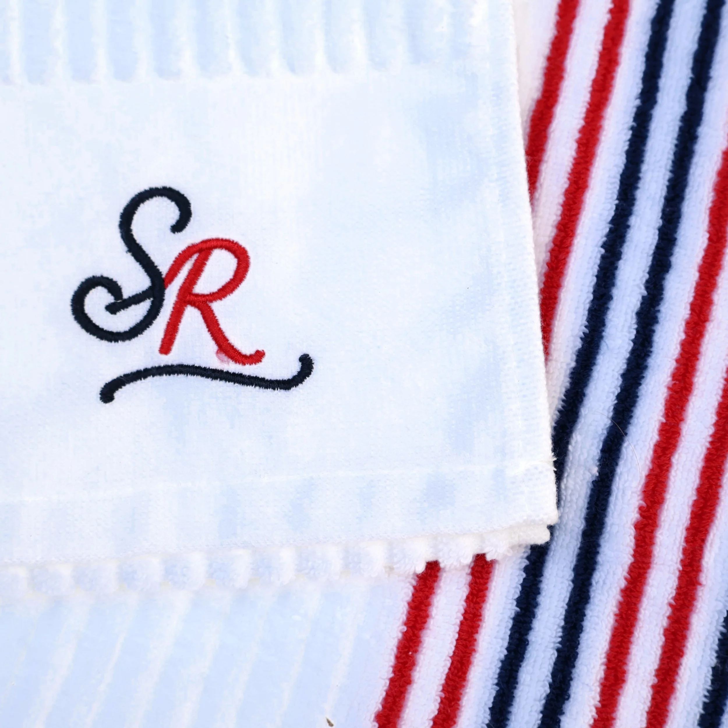 sunday-rolls-golf-towel-red-blue-stripe-logo-detail.jpg