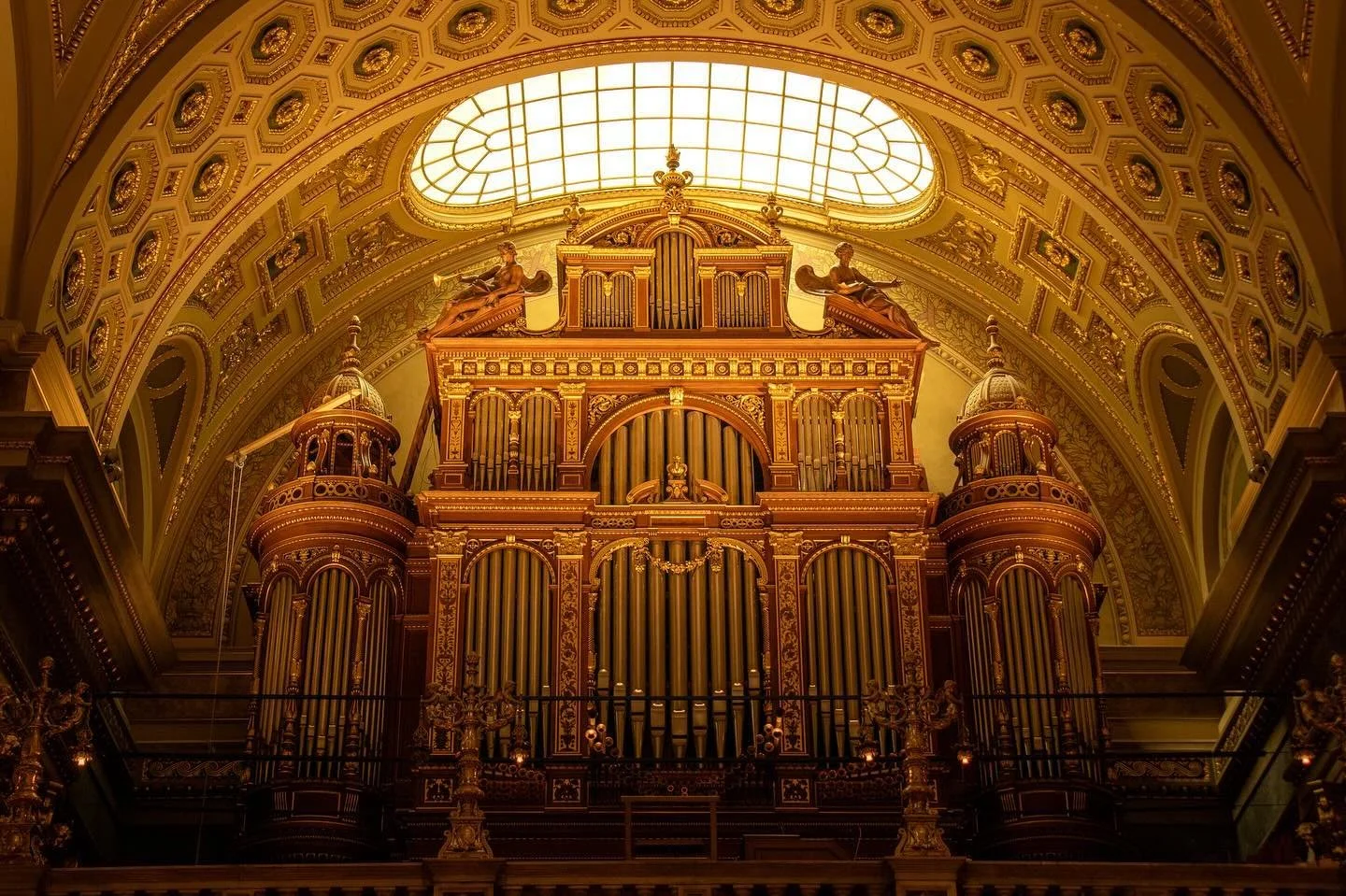 A hidden gem in St. Stephen&rsquo;s cathedral. 
Many organs are placed either next to the altar off to the side or at the back of the church. Just as you enter St. Stephen&rsquo;s Basilica in Budapest, turn around and there lies a beautiful organ orn
