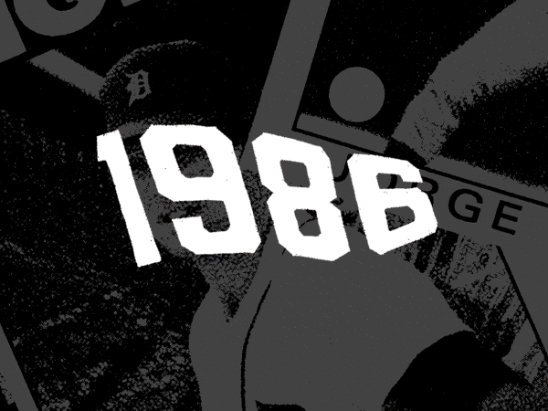 Close-up of the numbers '1986' in white on a black background, with radio dials and controls partially visible.