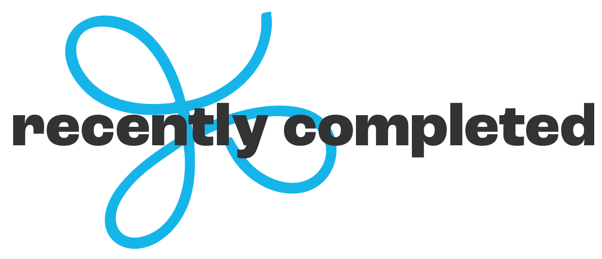 A graphic with a stylized blue decorative flower and the words "recently completed" in bold black text overlaying the flower.