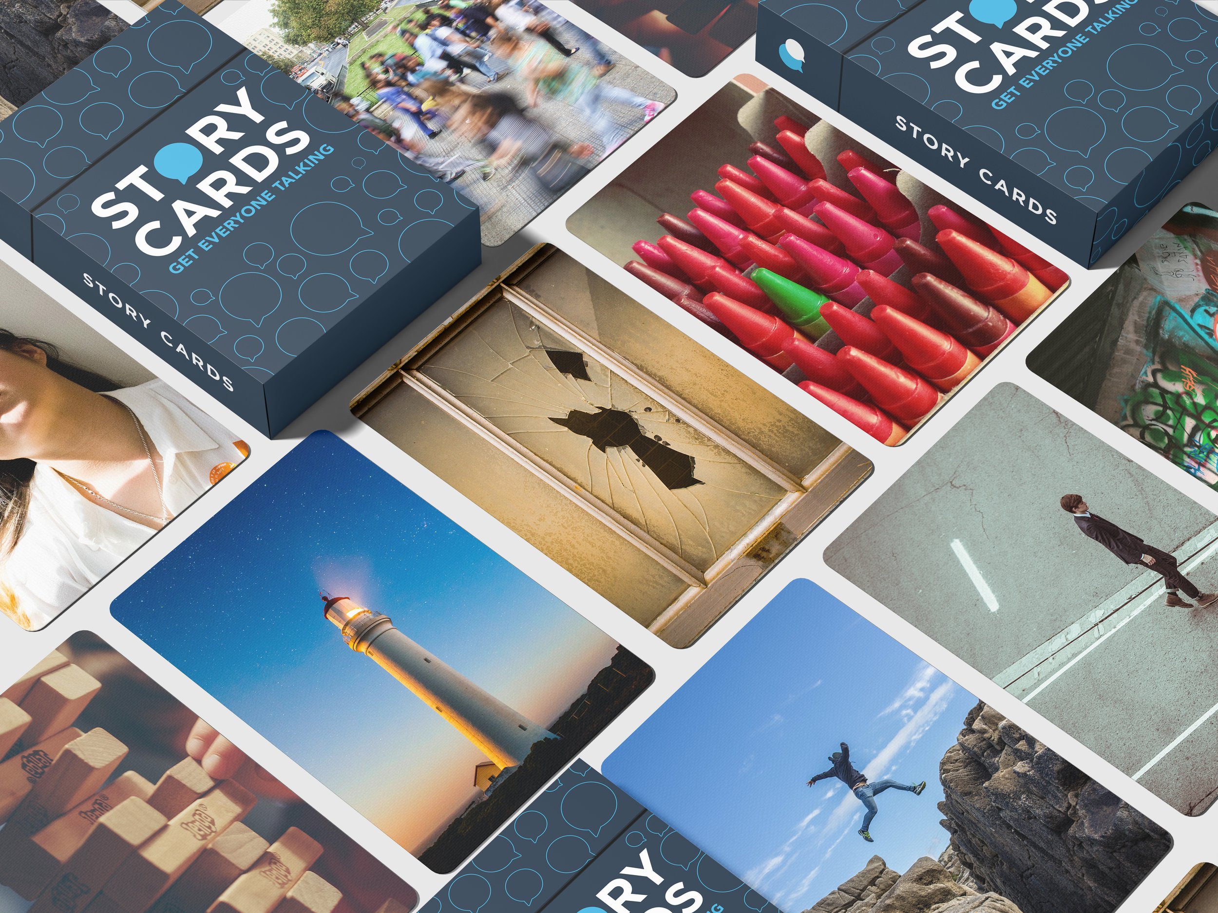 A collection of various photographs and story cards, including images of people, a broken window, lipsticks, a lighthouse at sunset, graffiti, a person standing on a street, a person jumping between rocks, and other scenes.