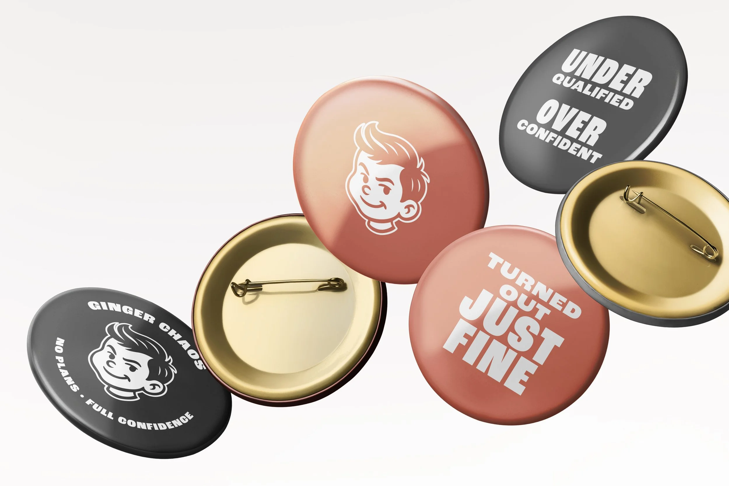 Five round pin badges with various slogans and logos, two showing backs with pin fasteners, three with designs including a smiling cartoon boy, and positive affirmations.