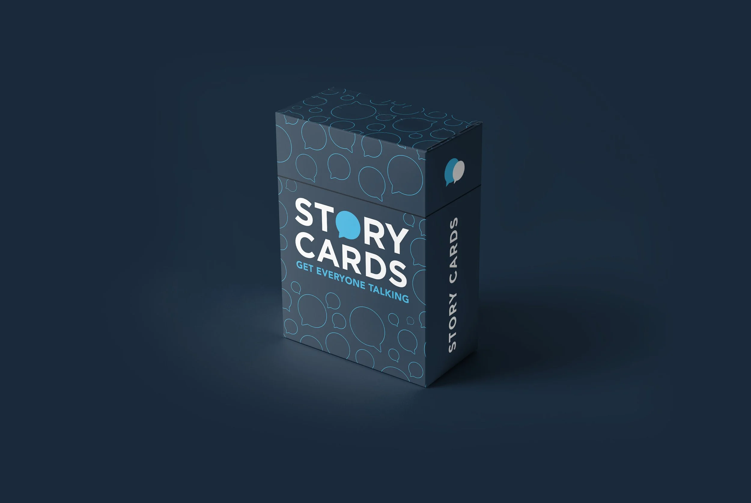 A blue box of story cards with speech bubbles design, labeled 'Story Cards' and 'Get Everyone Talking' on the front and side.