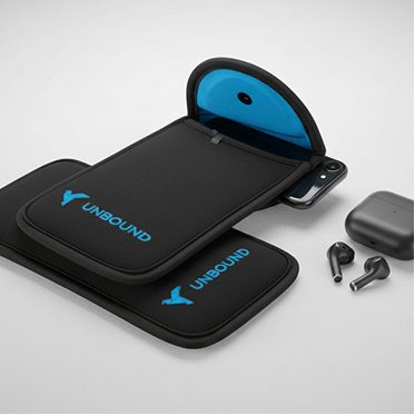 Unbound wireless earbuds with charging case, black ear tips, and protective carrying case.