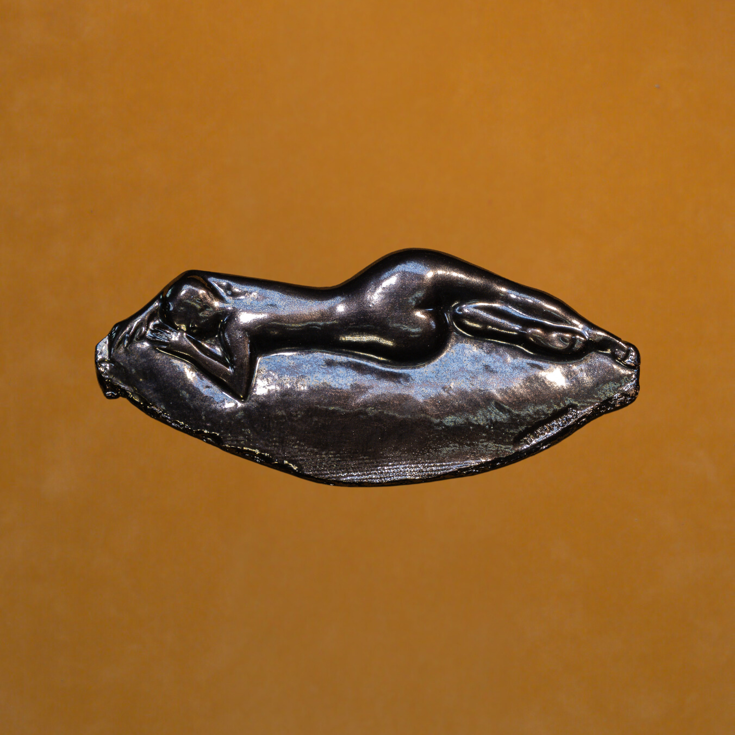 "Relief Studies", ceramic with metallic glaze, 8.5 × 13 in., 2019