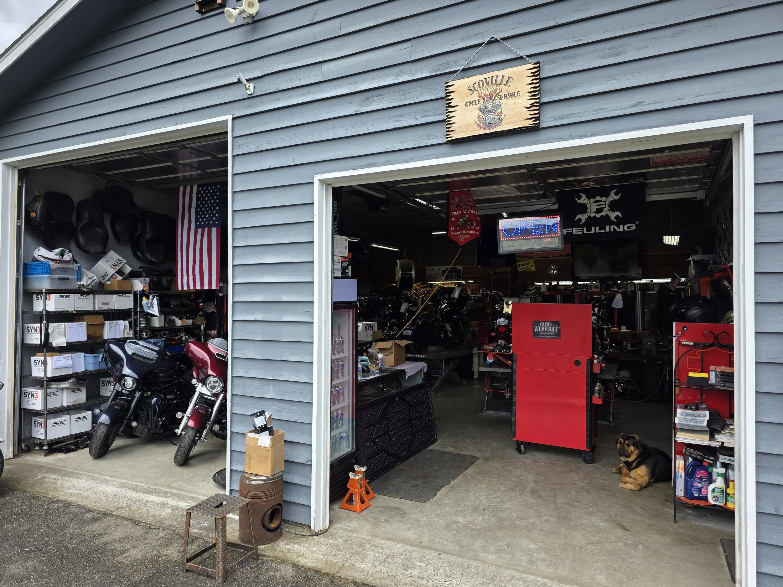 Open service bays and motorcycle inventory at Scoville Cycle Service.