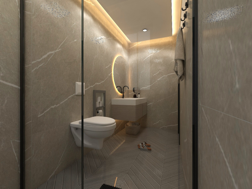 Modern bathroom with beige marble walls, floating sink with a backlit mirror, toilet, and a hanging towel
