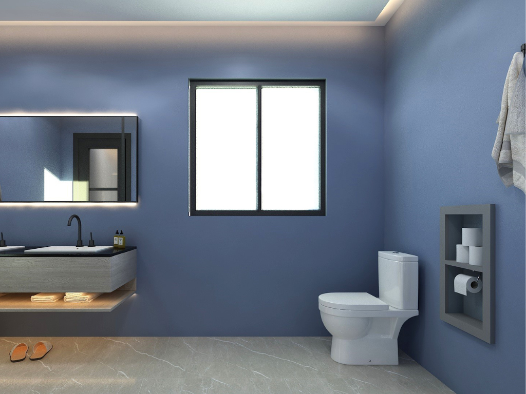 Modern bathroom with blue walls, a window, a floating vanity with a sink, a mirror, a toilet, a storage shelf with toilet paper and rolls, and slippers on the floor.