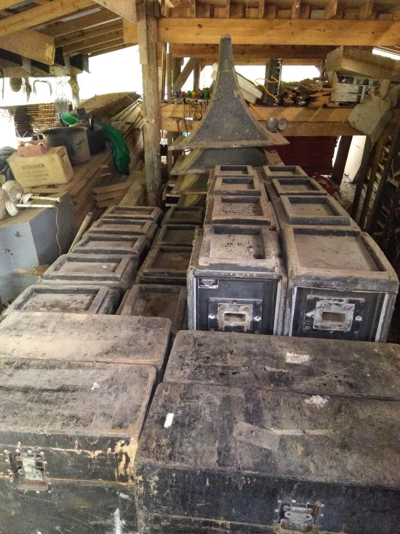 Vintage Showco speaker enclosures and horns in storage. The seller reported purchasing the collection at a Sound Productions auction and described it as equipment used by Led Zeppelin, Three Dog Night, and The Who.