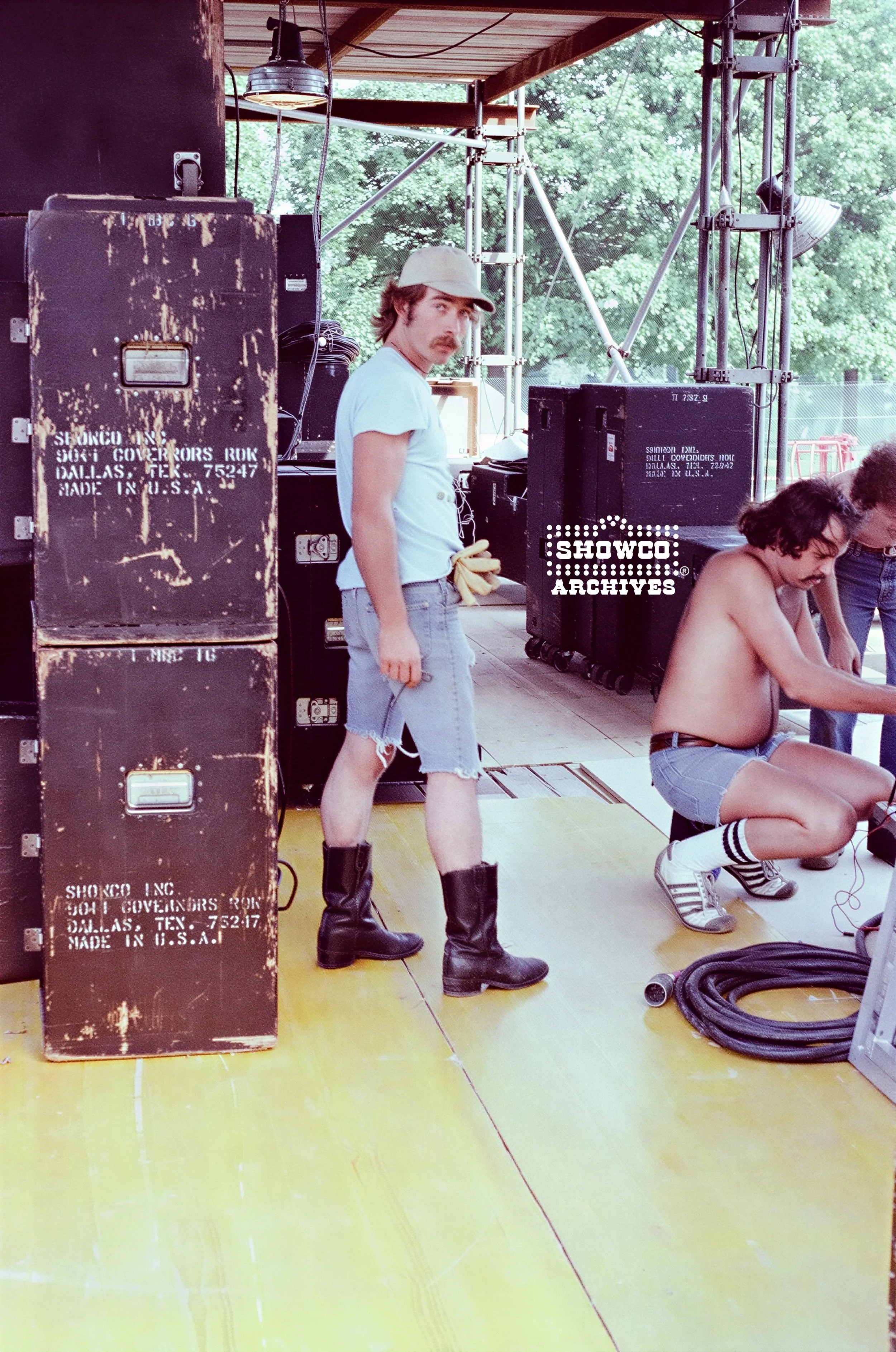 Morris Lyda, Craig Schertz and road cases side stage at Summertime Open Air Festival, Ulm, Germany, 1978. Courtesy of the Showco Archives.