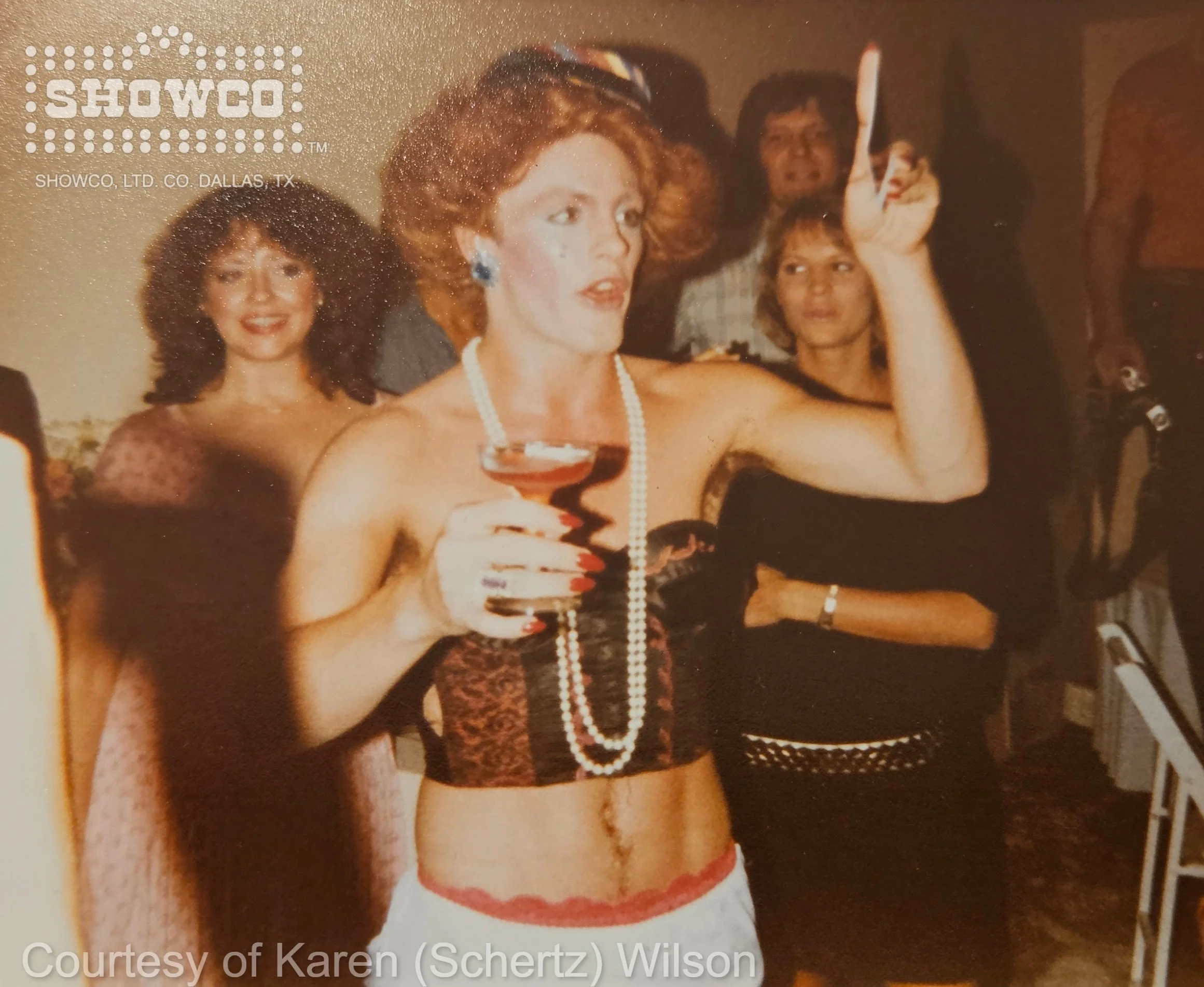 The surprise entertainer makes an unforgettable entrance as the room begins to realize the joke.