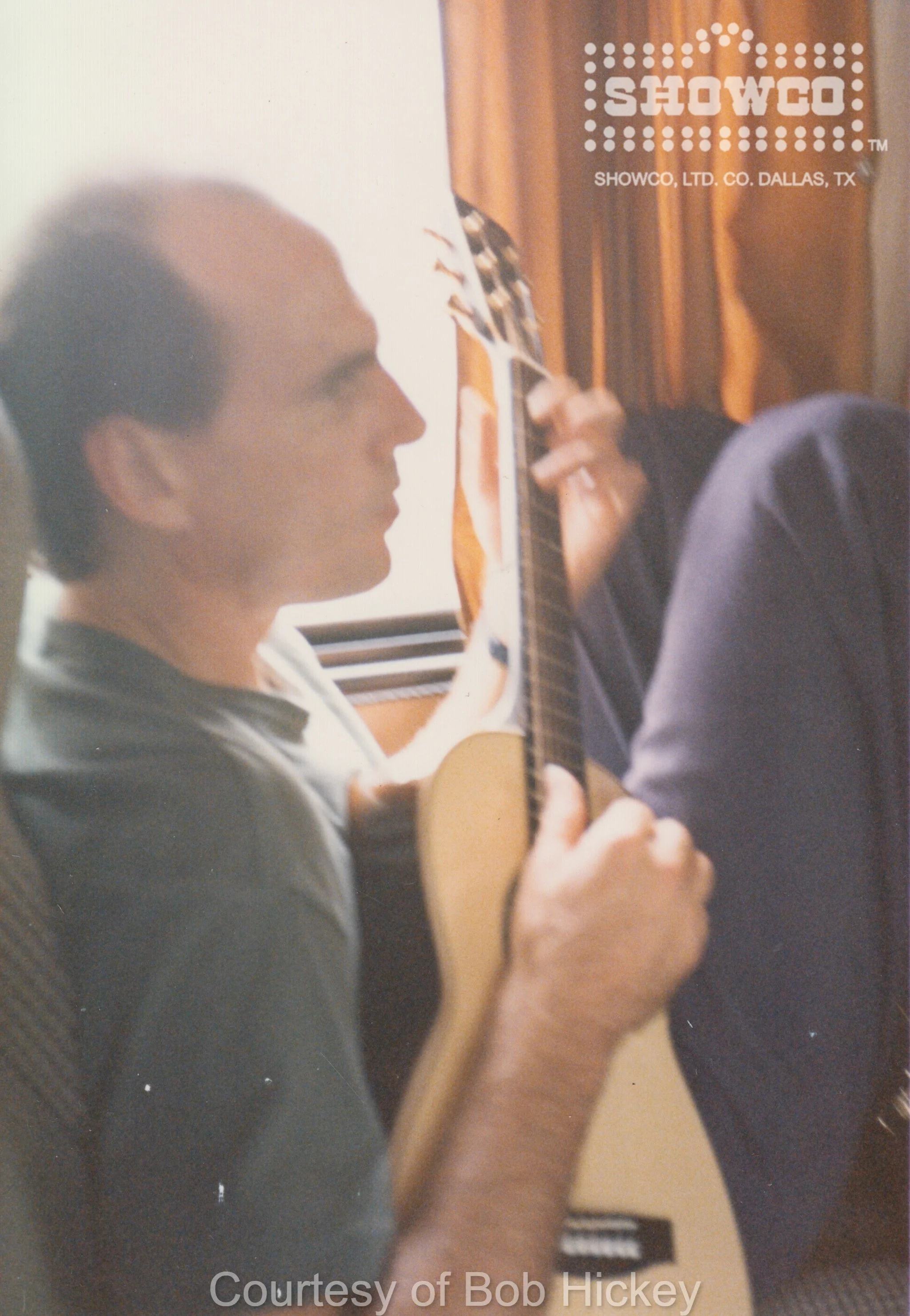 TAYLOR PLAYING GUITAR IN BUS.jpg