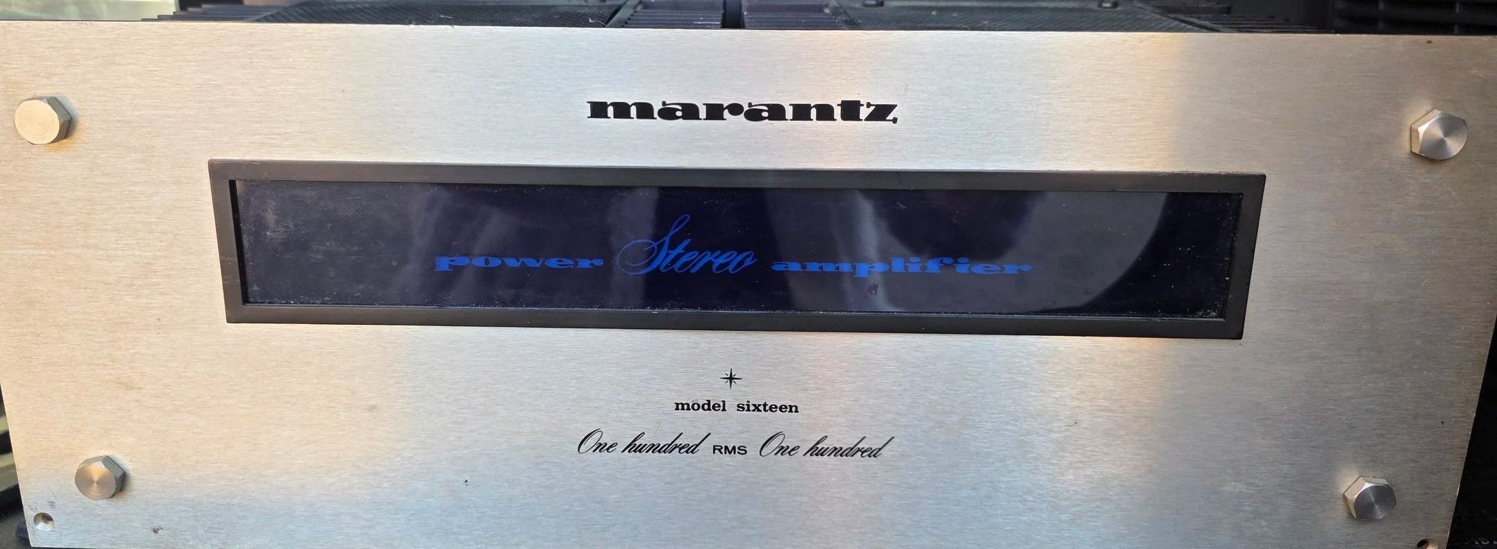 Silver Marantz 16b stereo amplifier with a black and blue display screen.