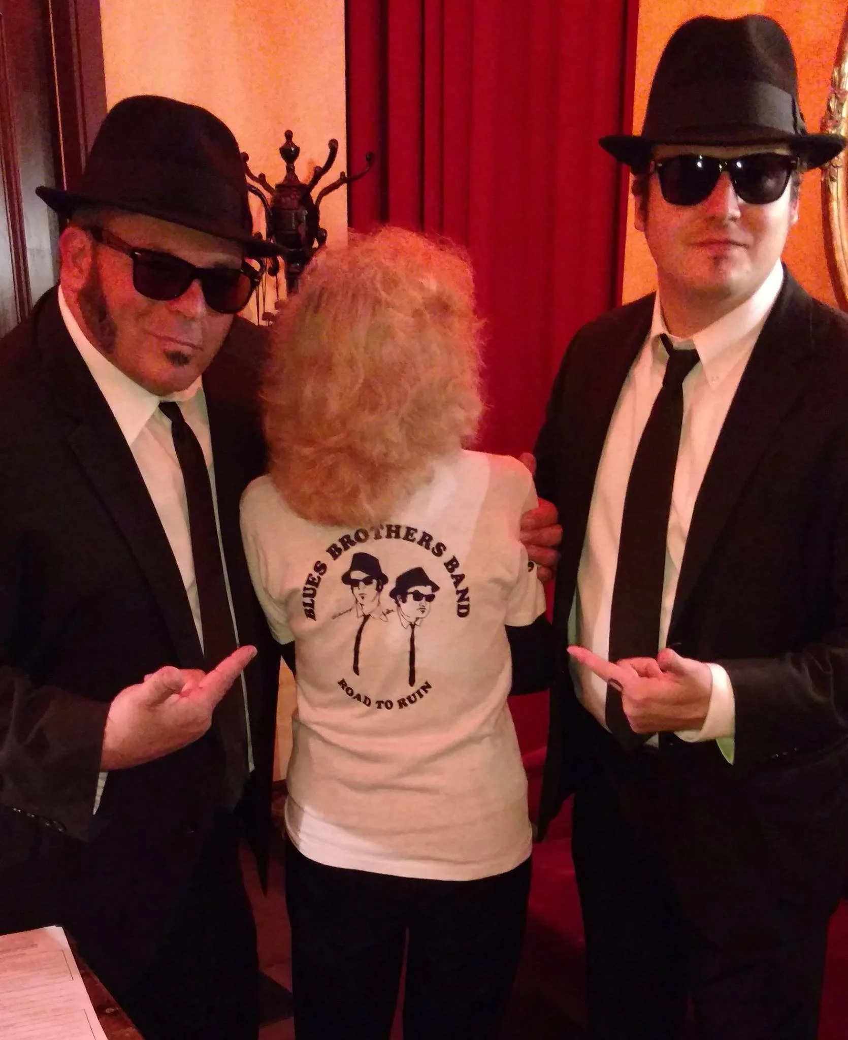 Alum, Jan Griffin in her Showco Blues Brothers shirt with Blues Brother Tribute Band