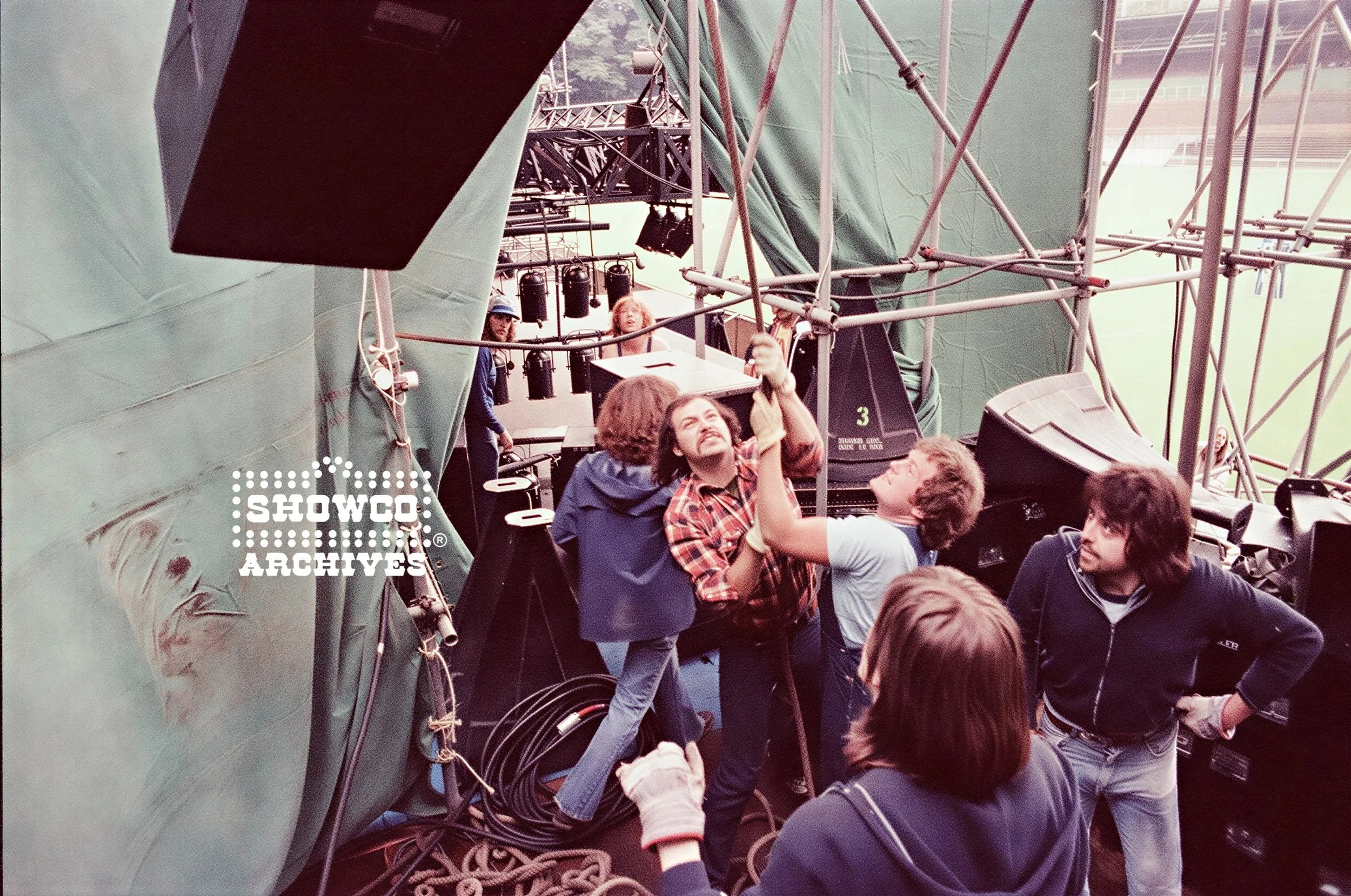 Mark Podany, Craig Schertz, Johnny Roberts and crew working side stage at Summertime Open Air Festival, Ulm, Germany, 1978. Courtesy of the Showco Archives. 