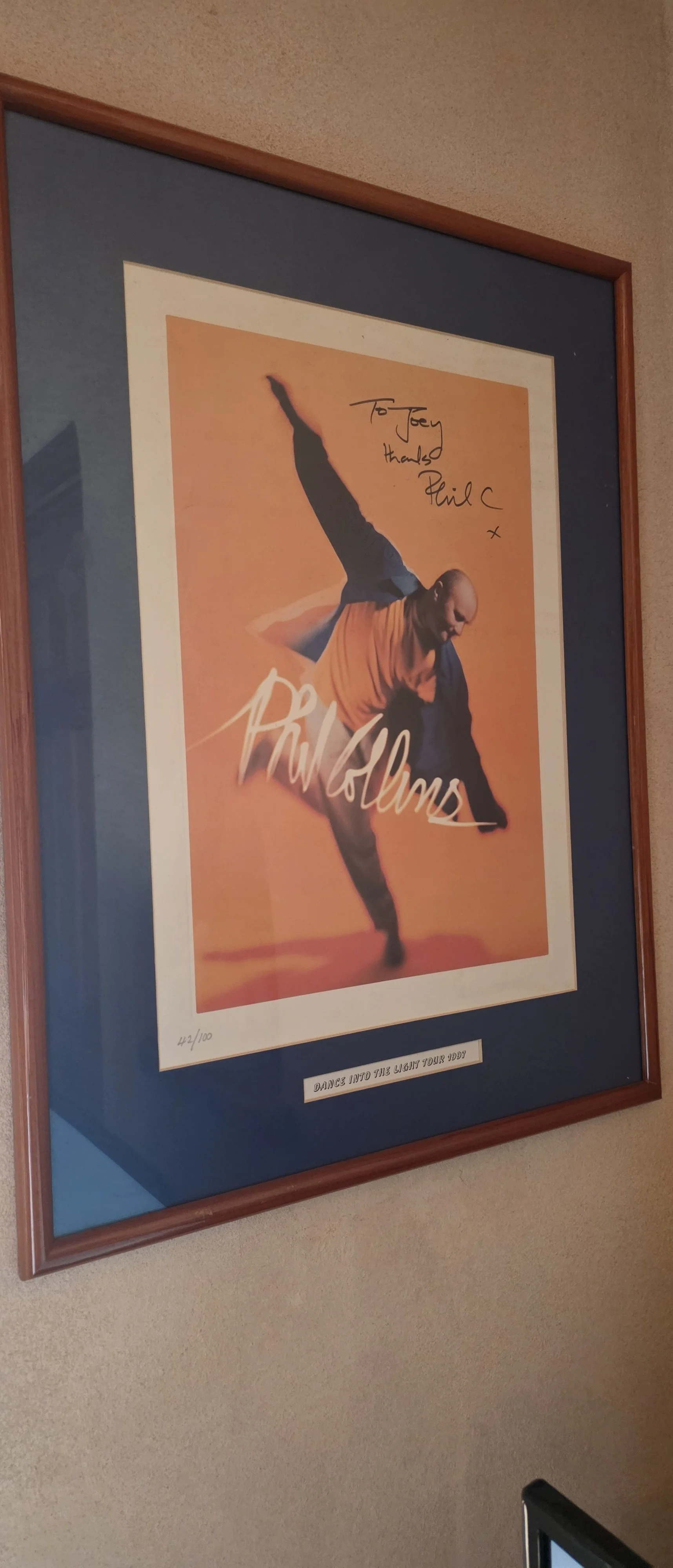 Personalized Phil Collins print addressed to Joey, with a Dance Into the Light Tour 1997 frame label. Joey Chardukian Collection.