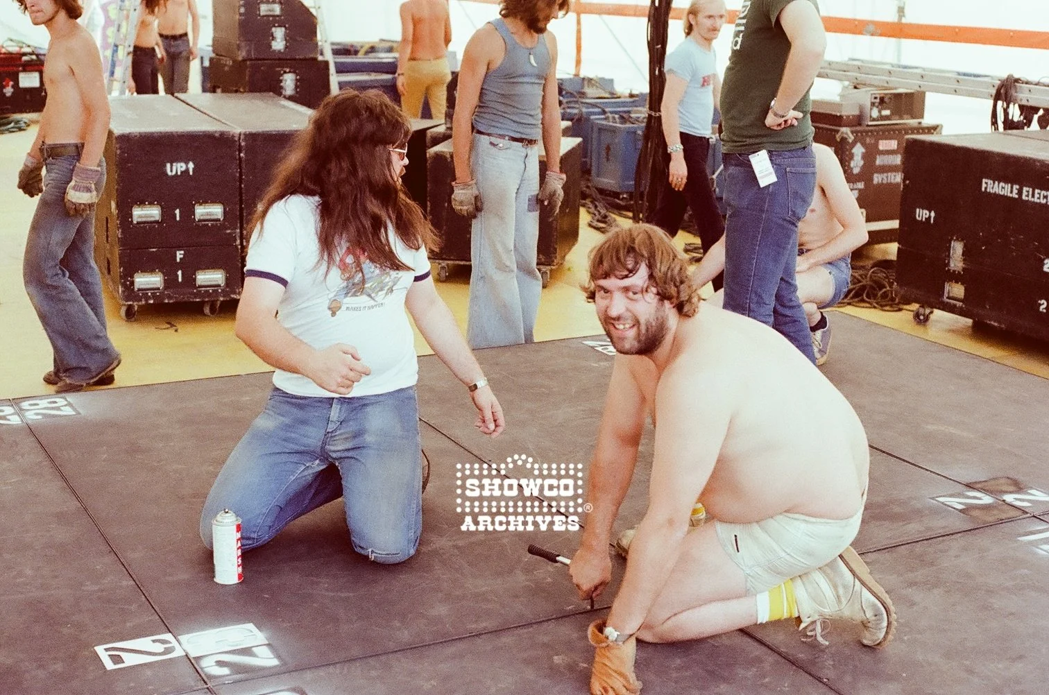 Geoff “Bison” Banks and unidentified crew member side stage at Summertime Open Air Festival, Ulm, Germany, 1978. Courtesy of the Showco Archives.