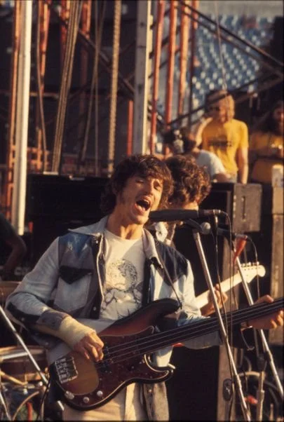 Ted Tittle in Showco shirt behind Rick Danko (The Band)