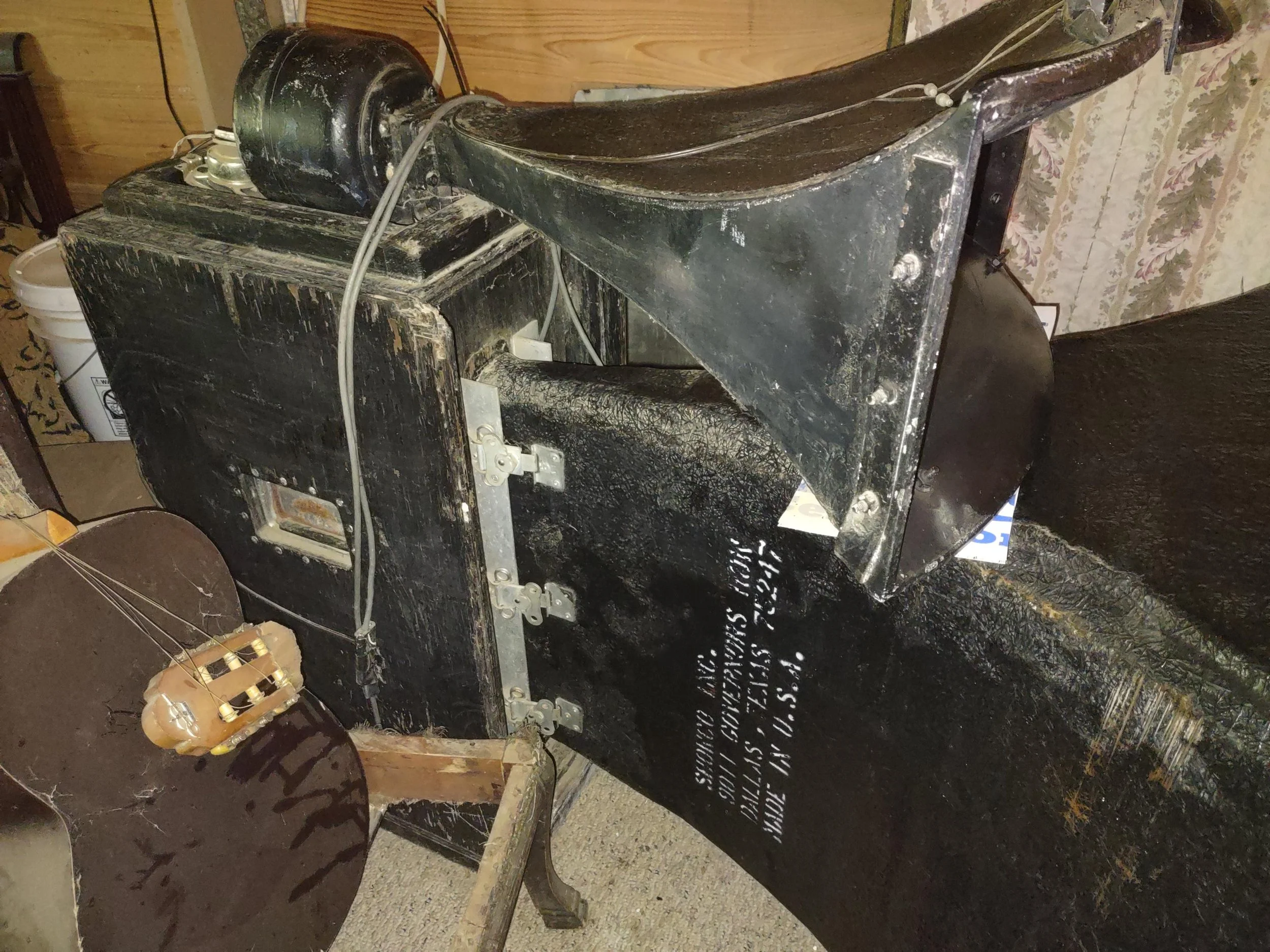 Vintage Showco speaker enclosures and horns in storage. The seller reported purchasing the collection at a Sound Productions auction and described it as equipment used by Led Zeppelin, Three Dog Night, and The Who.