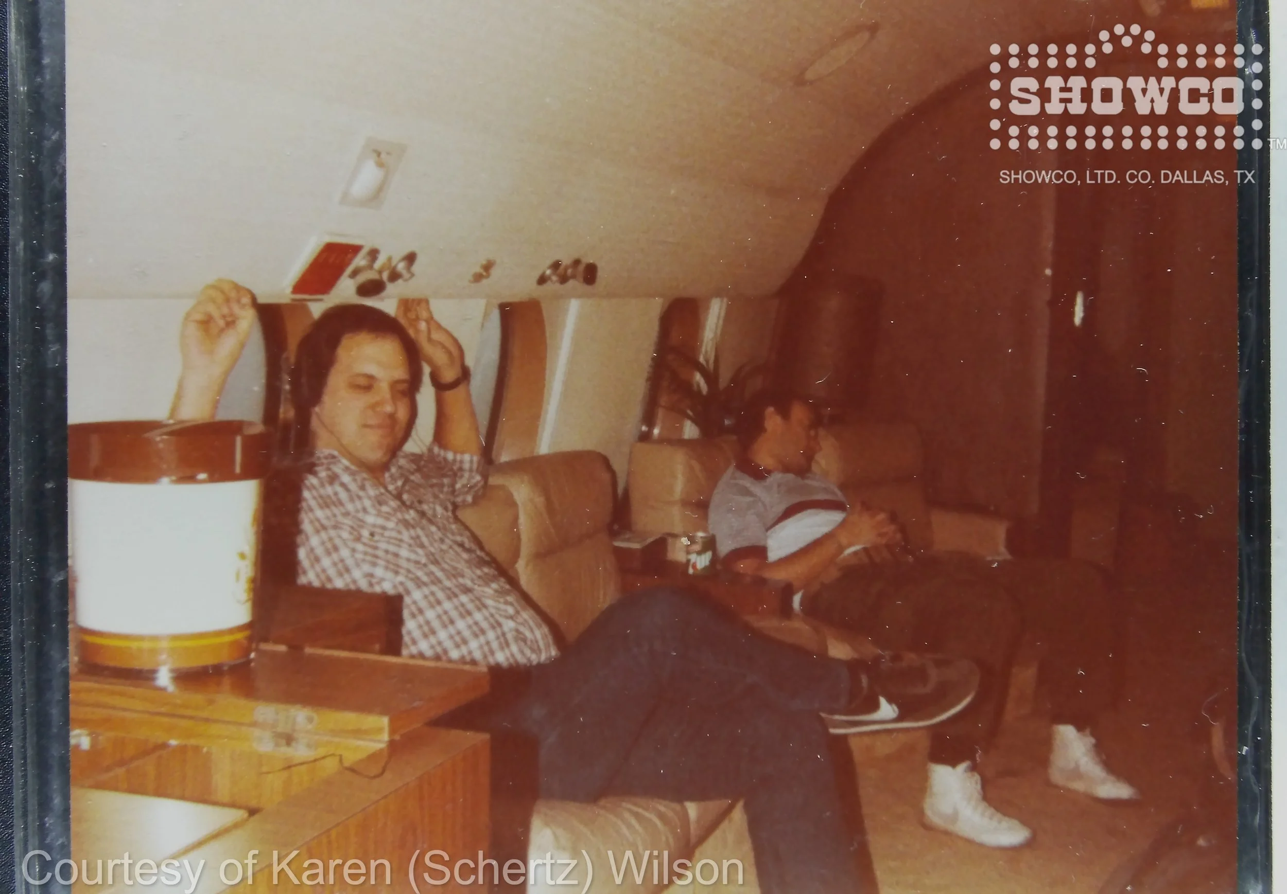 Craig Schertz, Phil Collins asleep on plane December 1983
