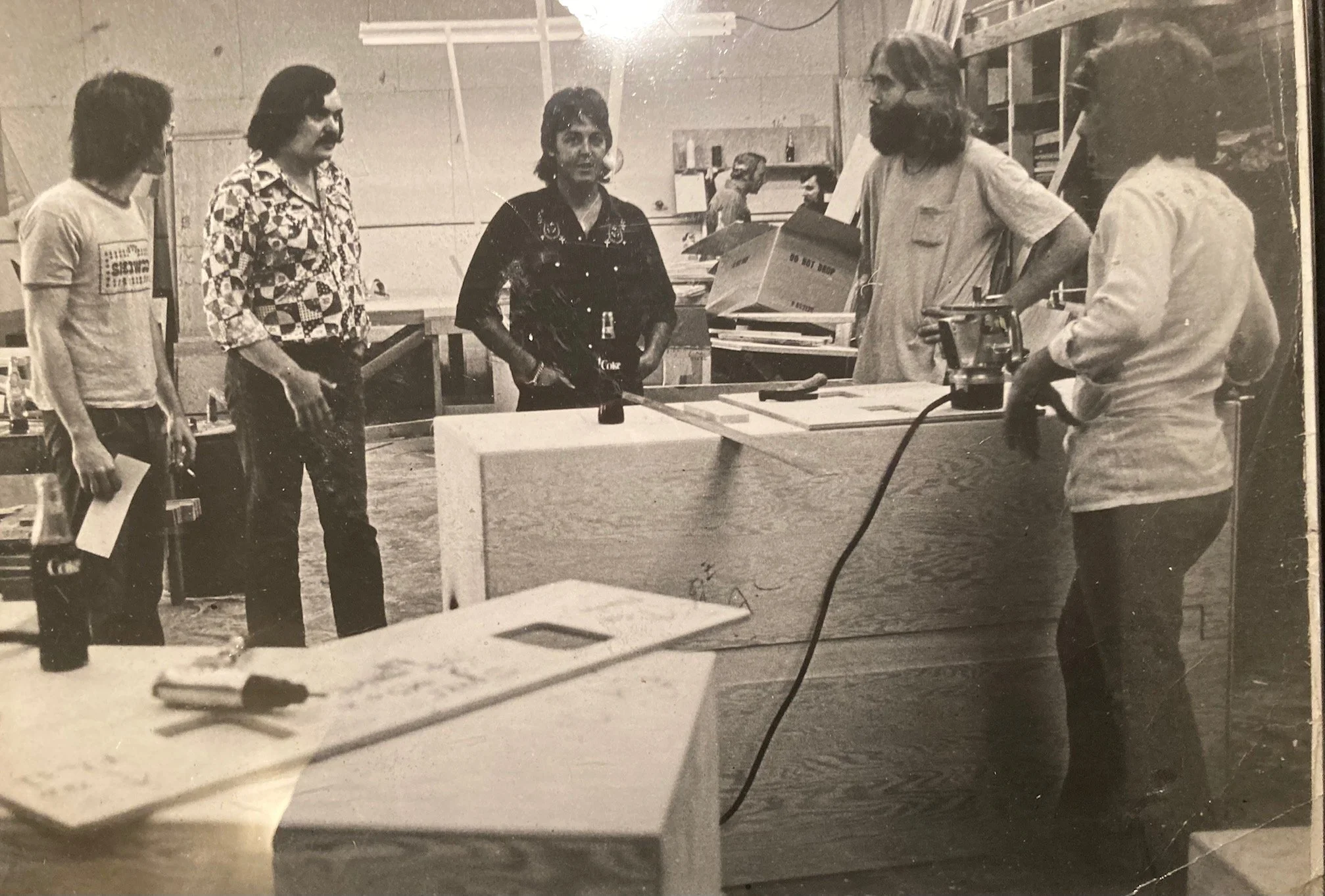 George Wheatley? in Showco shirt, Rusty Brutsche, Paul McCartney, ?, ? - visiting Showco shop