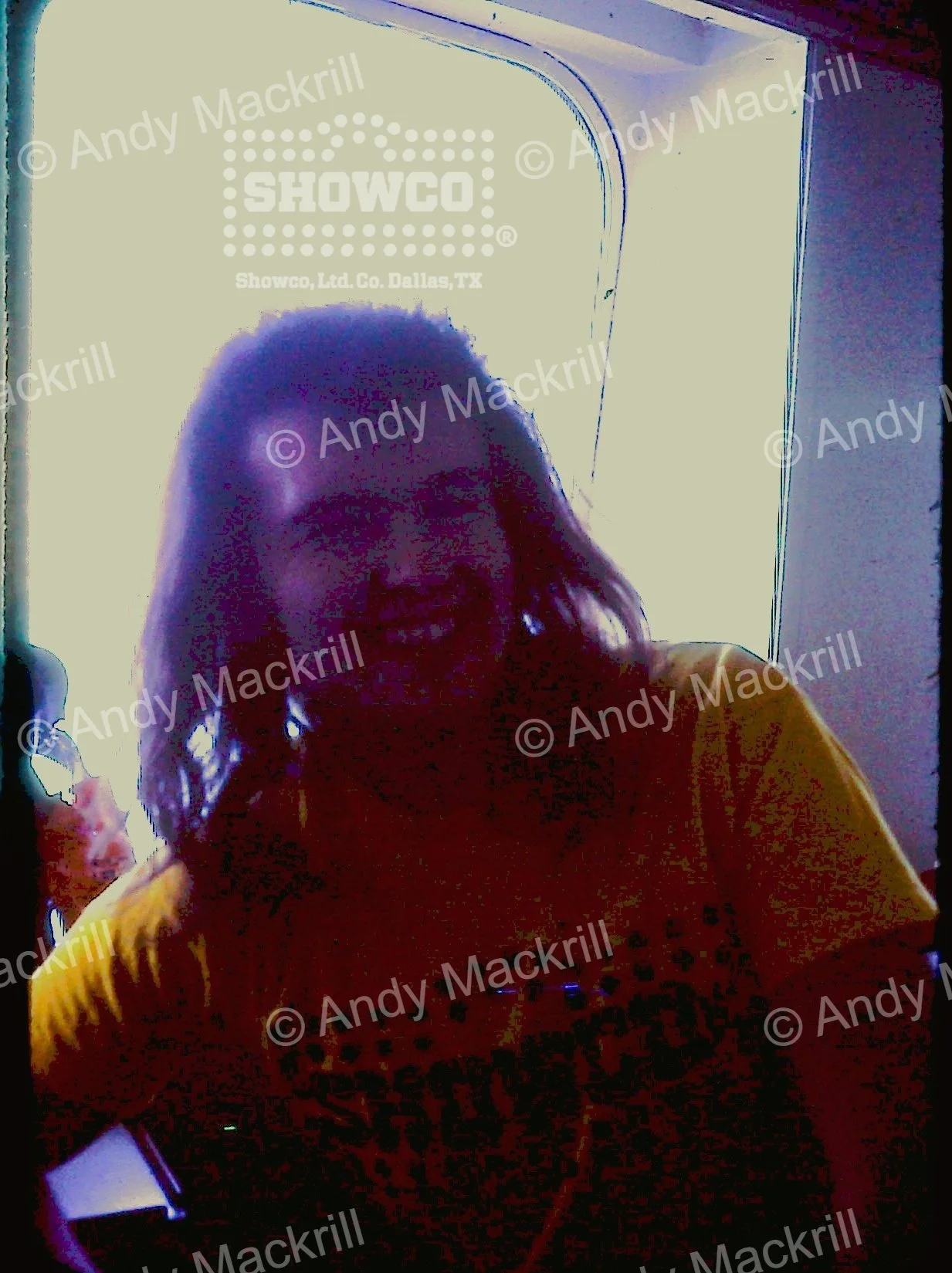 Genesis Europe 1976 - Andy Mackrill with hair-SAhowco shirt.JPG