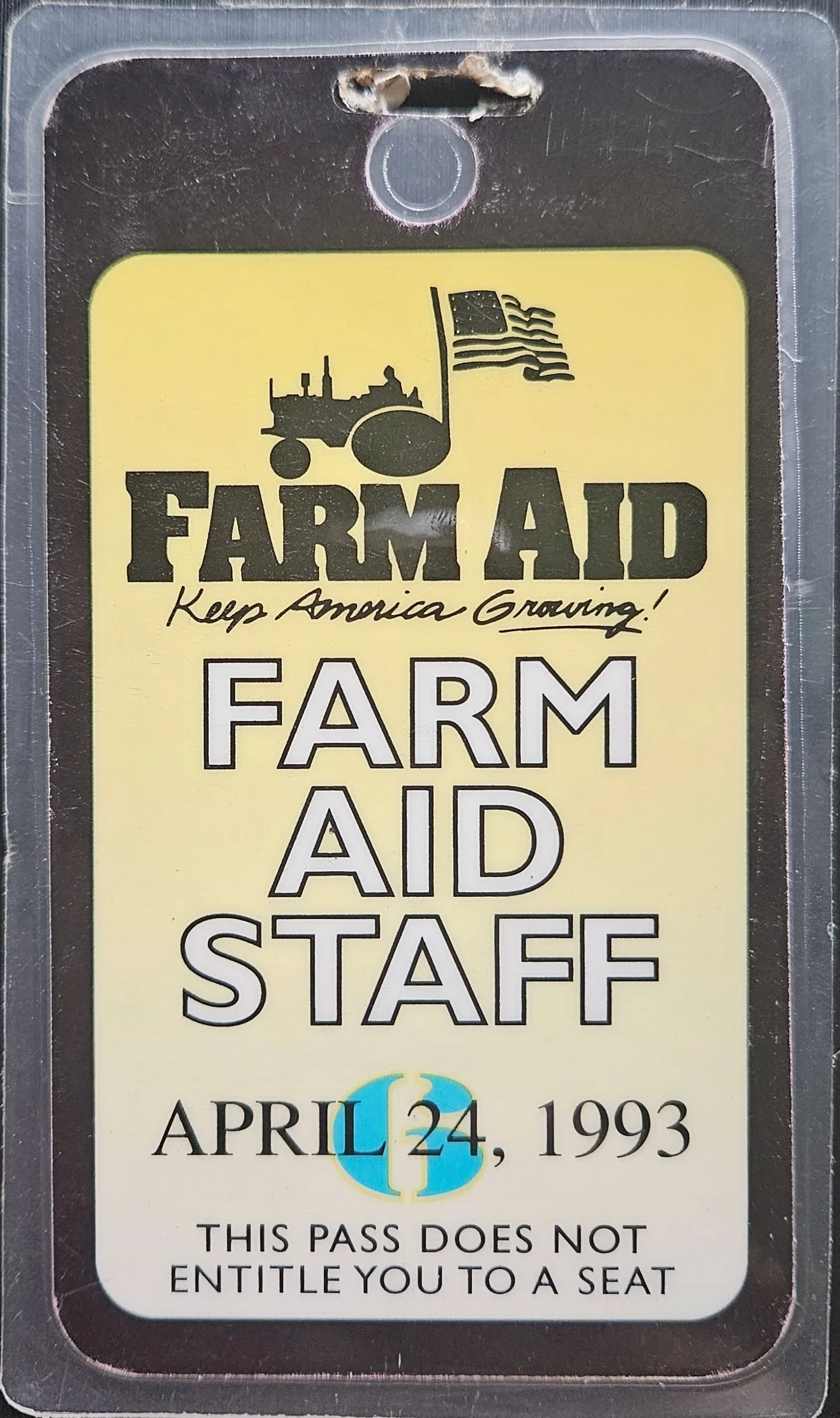 Farm Aid staff laminate dated April 24, 1993, featuring the “Keep America Growing!” logo.