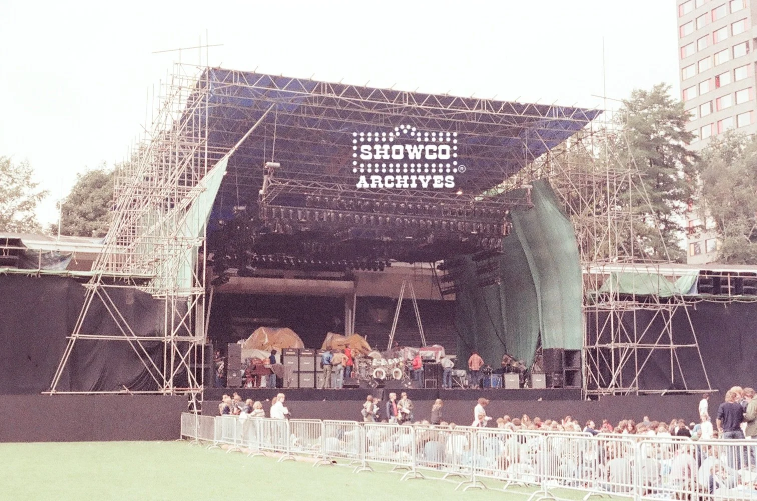 Genesis Mirror Stage build with fans arriving at Summertime Open Air Festival, Ulm, Germany, 1978. Courtesy of the Showco Archives.