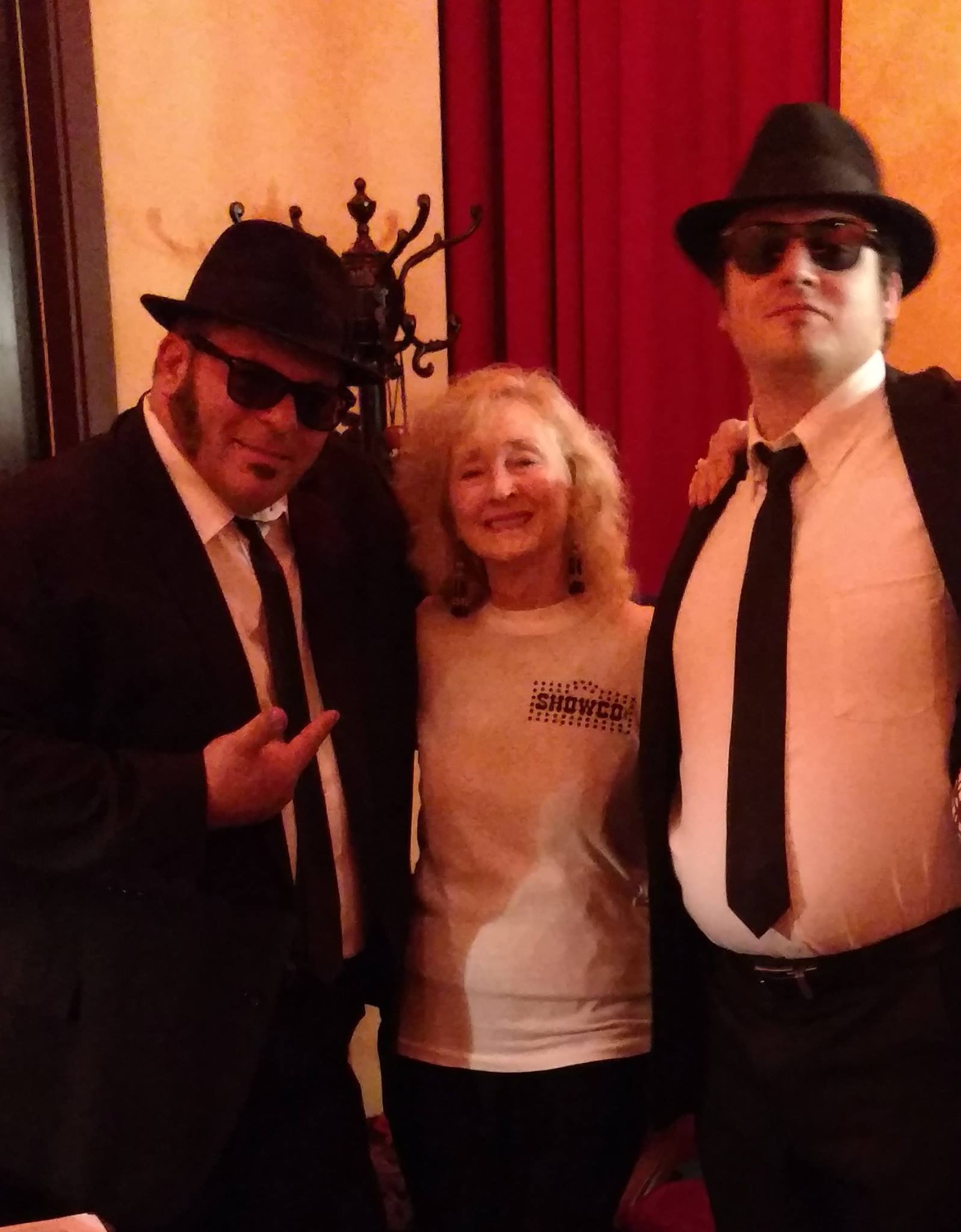 Alum, Jan Griffin in her Showco Blues Brothers shirt with Blues Brother Tribute Band