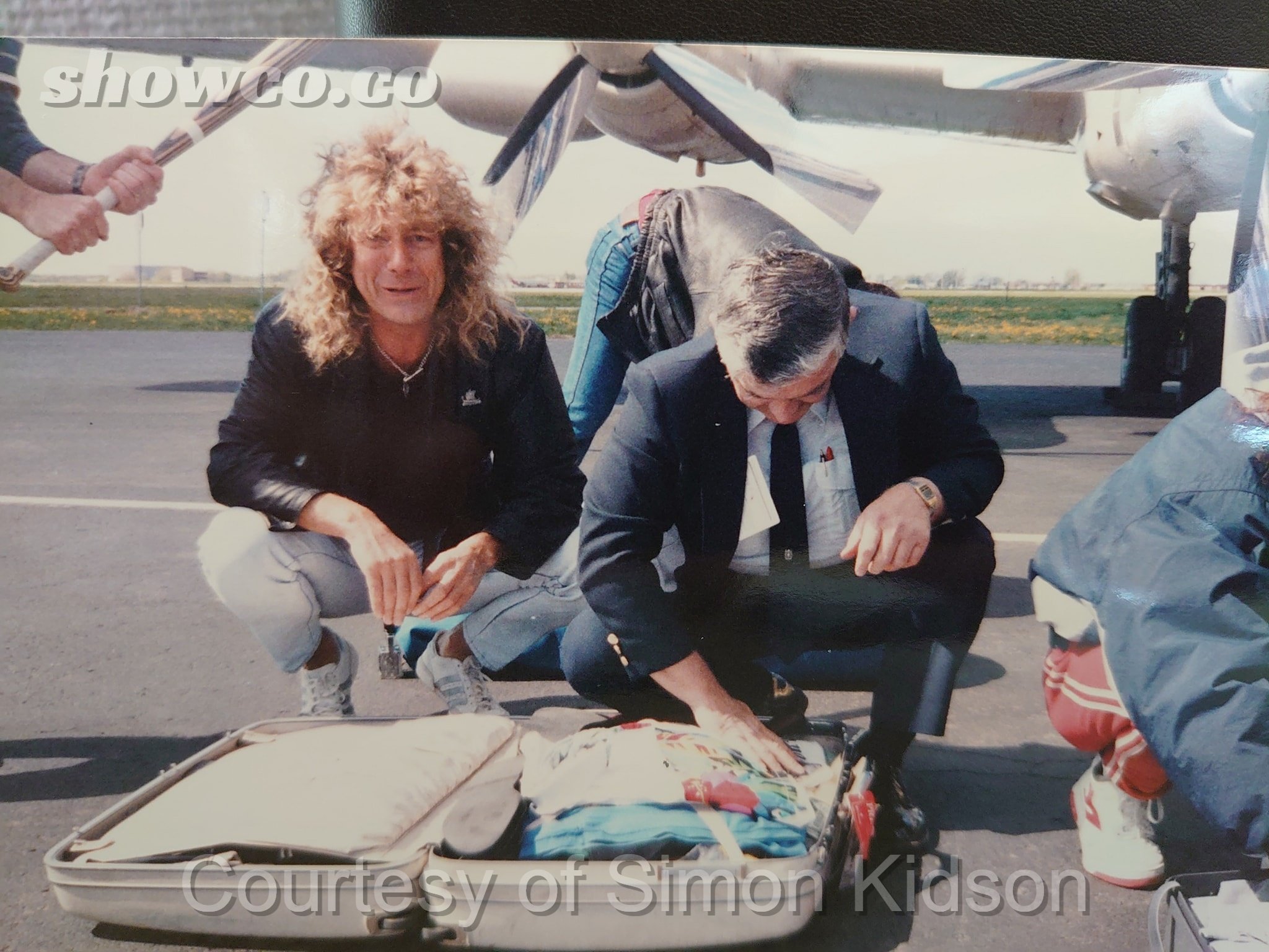 Robert Plant having his bags inspected at airport