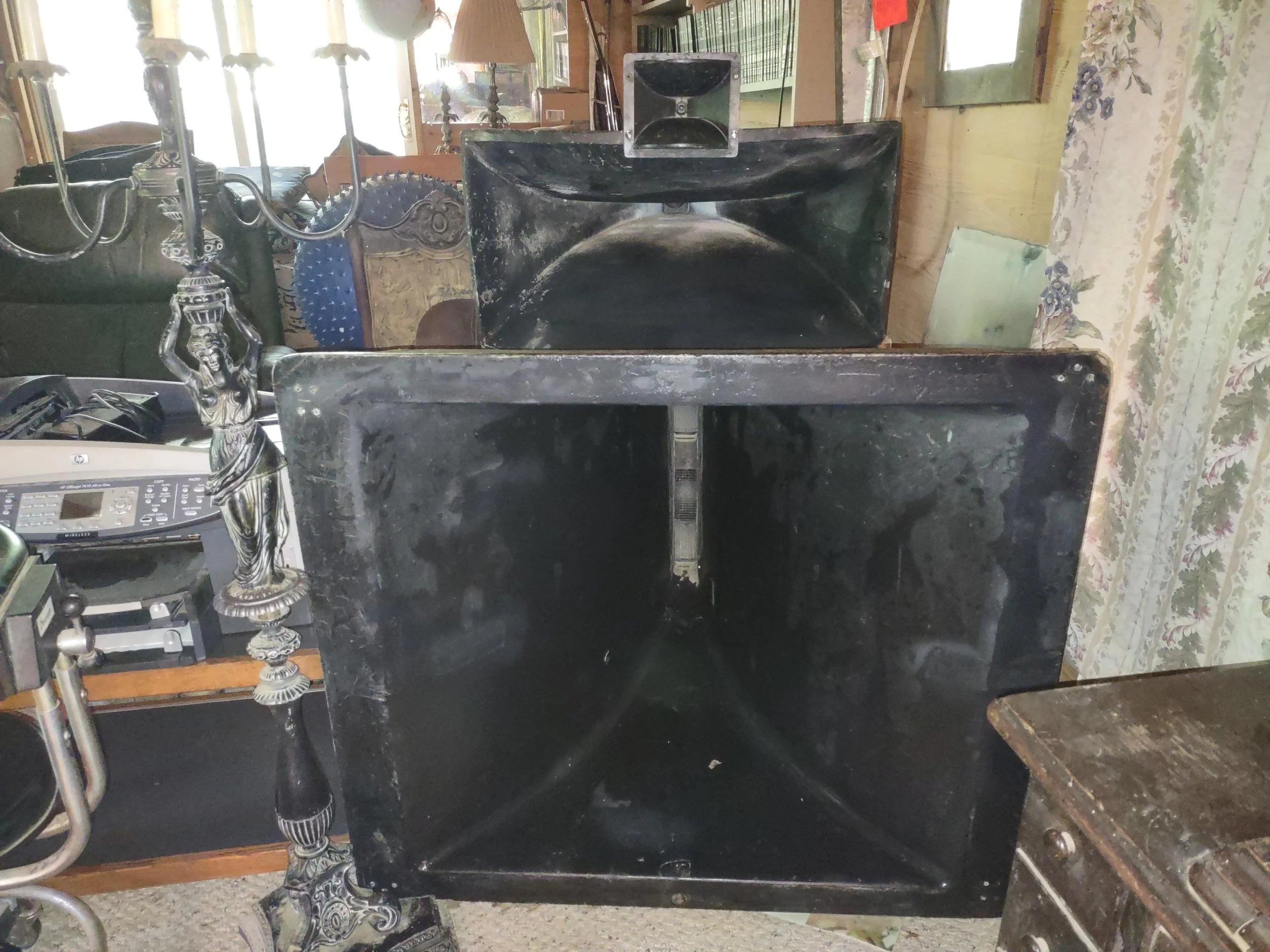Vintage Showco speaker enclosures and horns in storage. The seller reported purchasing the collection at a Sound Productions auction and described it as equipment used by Led Zeppelin, Three Dog Night, and The Who.