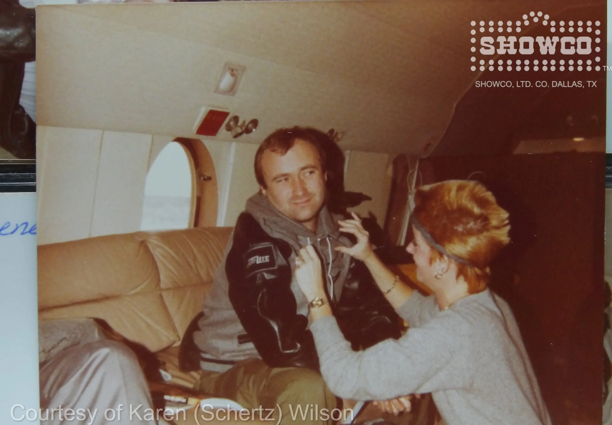 PHIL JILL PLANE VARI-LITE JACKET GENESIS TOUR 12.83.JPG