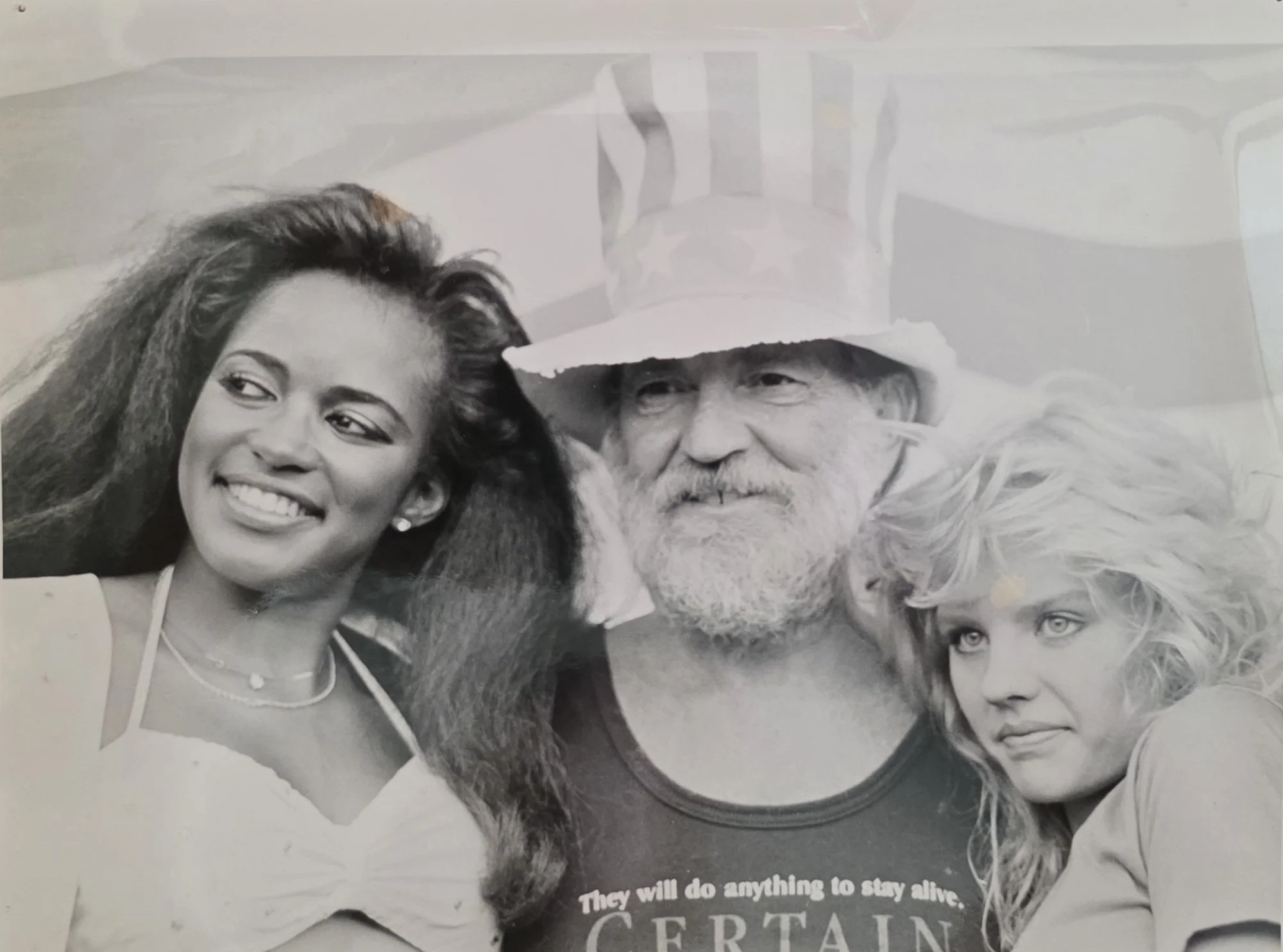 Willie Nelson w/Playboy Bunnies - Farm Aid 1986 - photo by Ritchie McHam