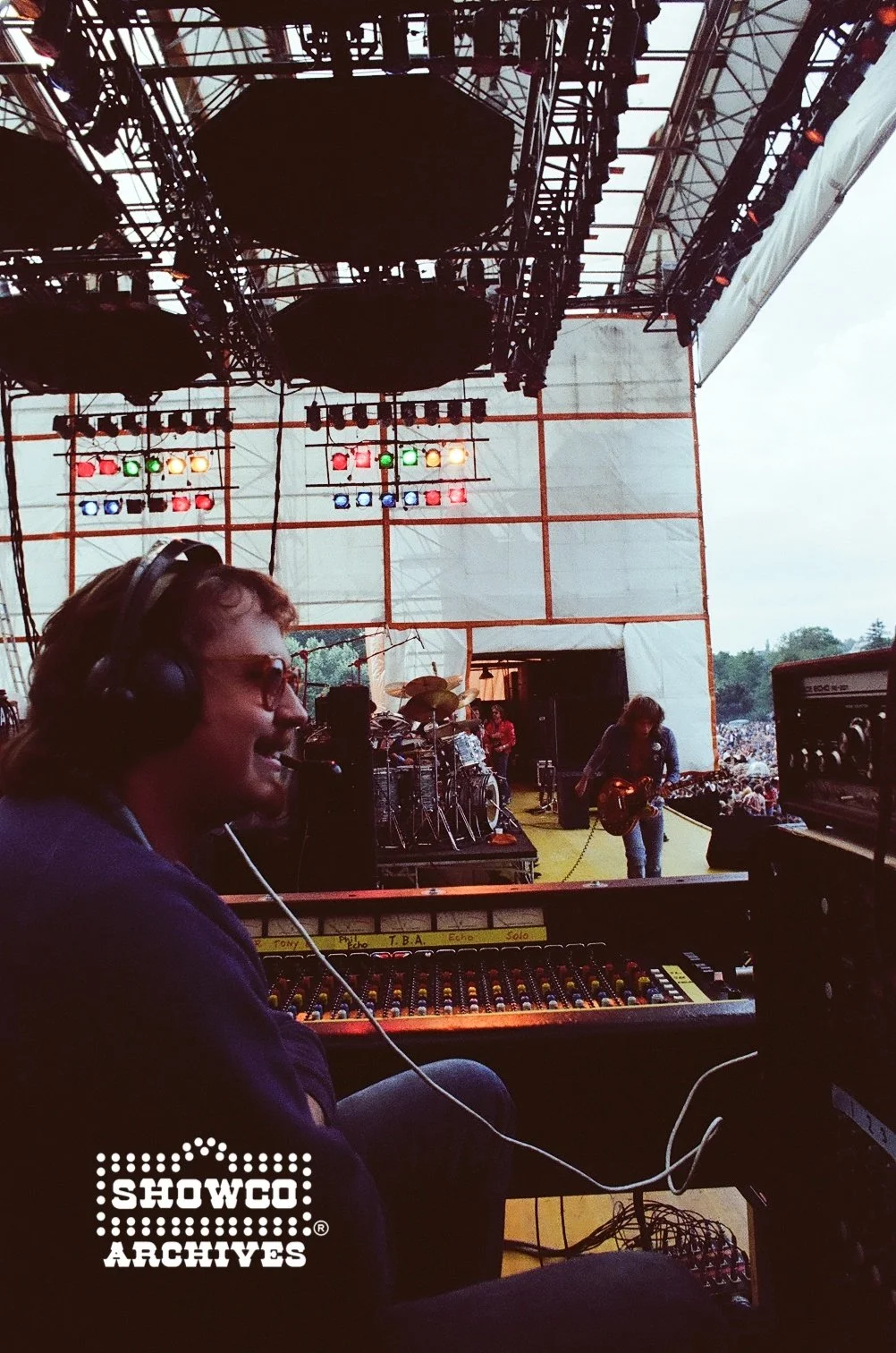 ML Procise at the monitor console with the Genesis Mirror Stage setup at Summertime Open Air Festival, Ulm, Germany, 1978. Alvin Lee playing. Courtesy of the Showco Archives.