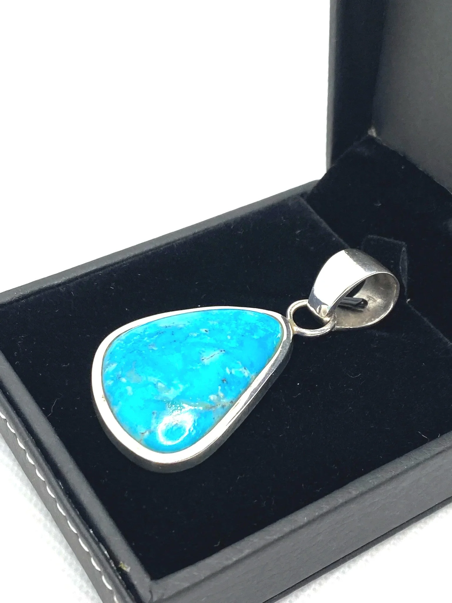 Turquoise Encased in Sterling Silver