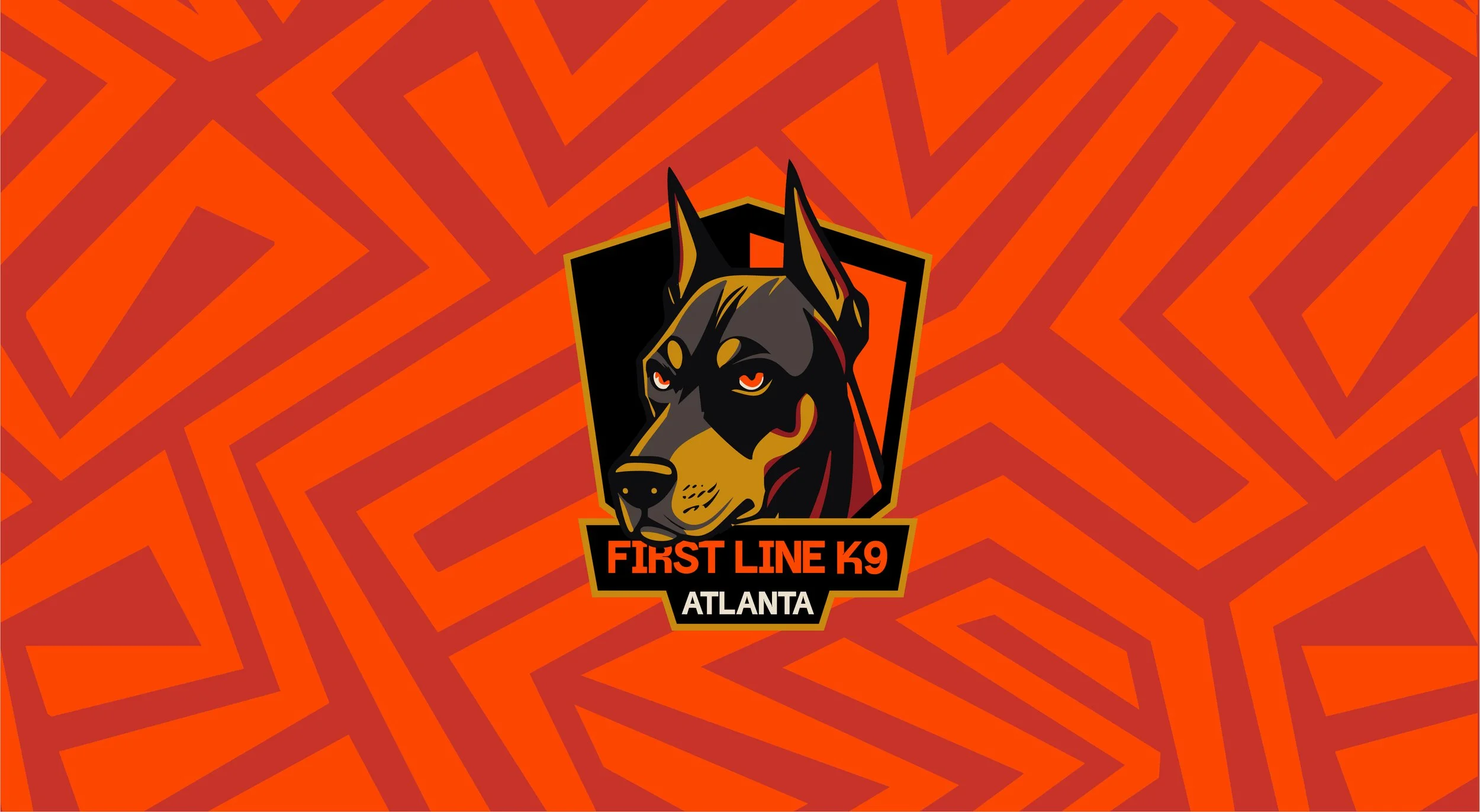 Logo of First Line K9 Atlanta featuring a stylized black and gold German Shepherd dog's head with orange eyes against an orange and red patterned background.