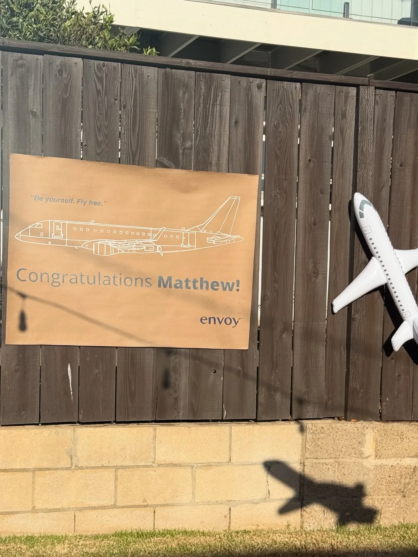 We hope you &ldquo;envoy&rdquo; Dallas! 

This banner was so fun to paint. We followed the Envoy style guide to a t! It was fun watching the reaction of our client when he realized that the airplane, line spacing, and fonts were all up to the Envoy a