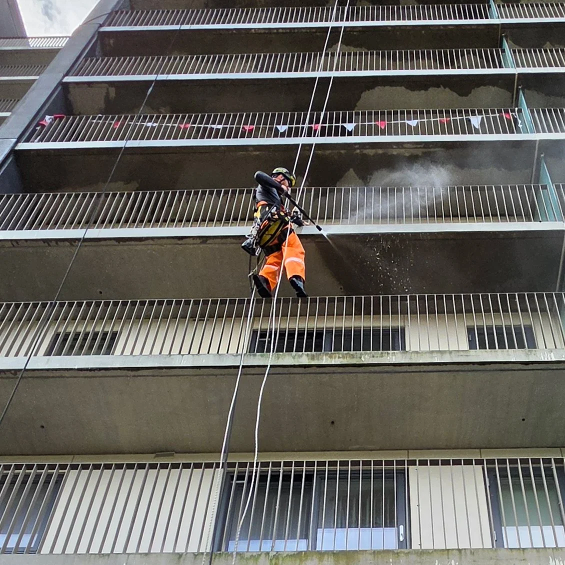 Clan Ropes worker, safely washing a building in Glasgow, Scotland. 