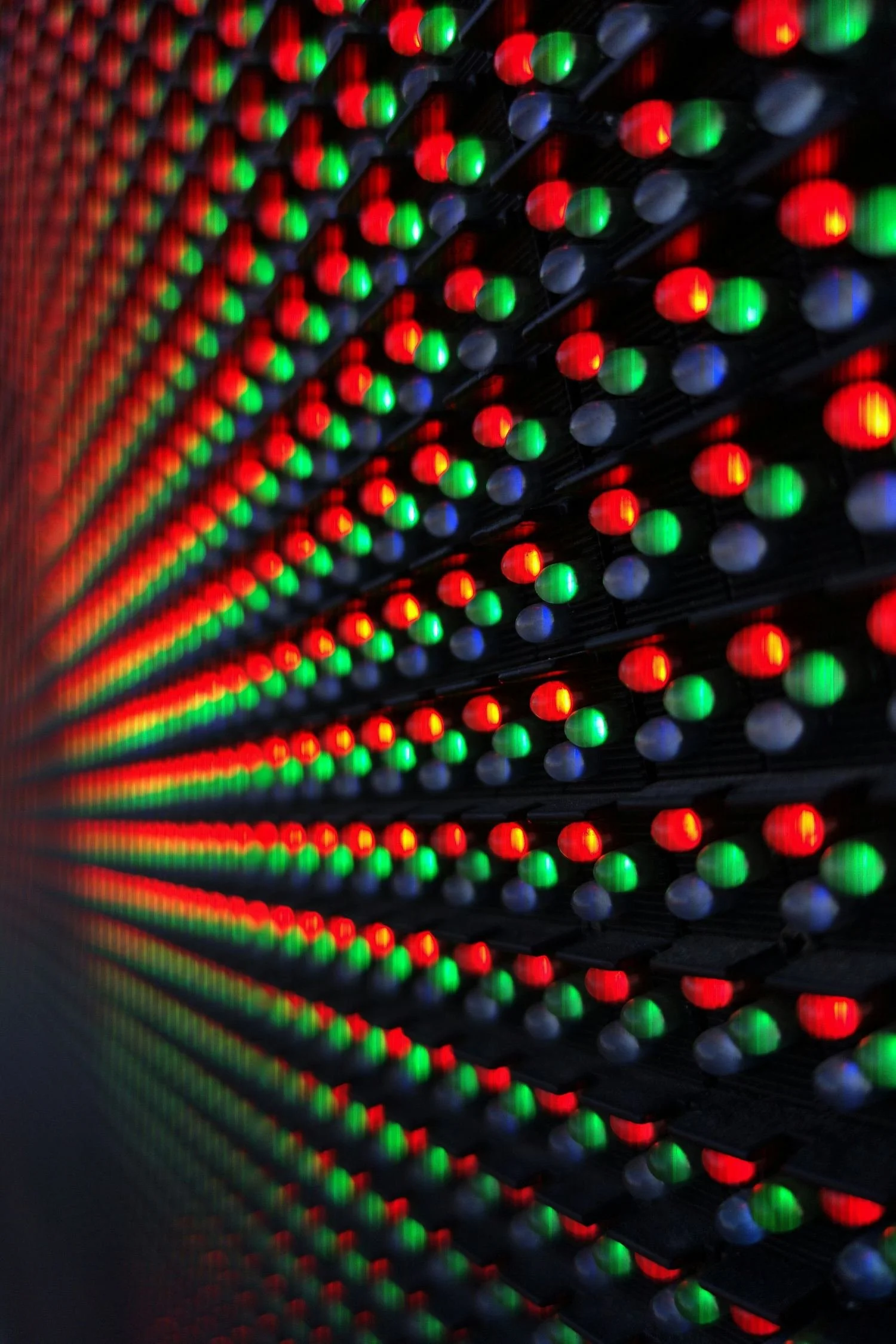 Close-up of LED video wall pixels glowing red, green and blue