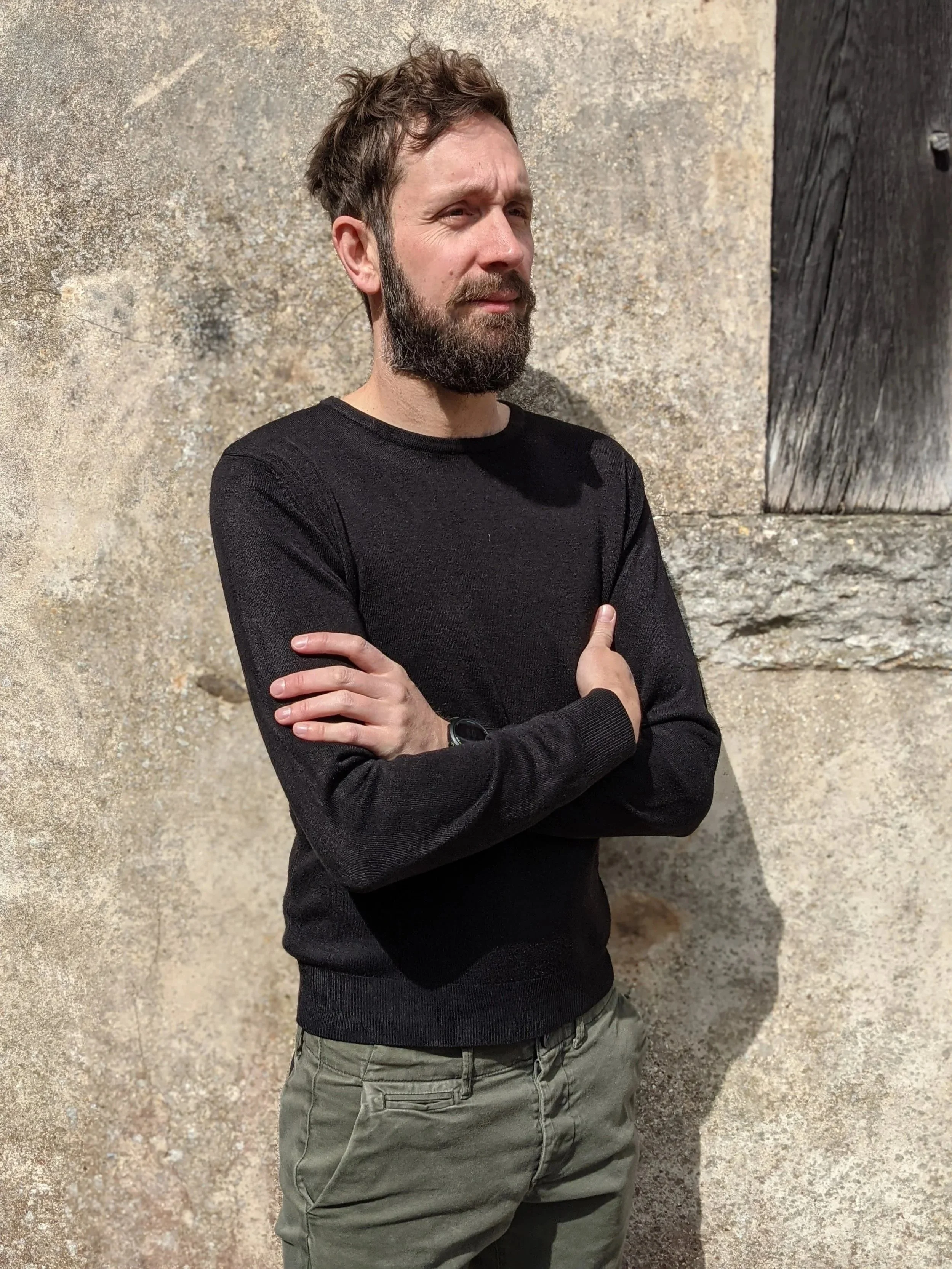 Tobias Weaver reviewing house plans in Hampshire architectural studio