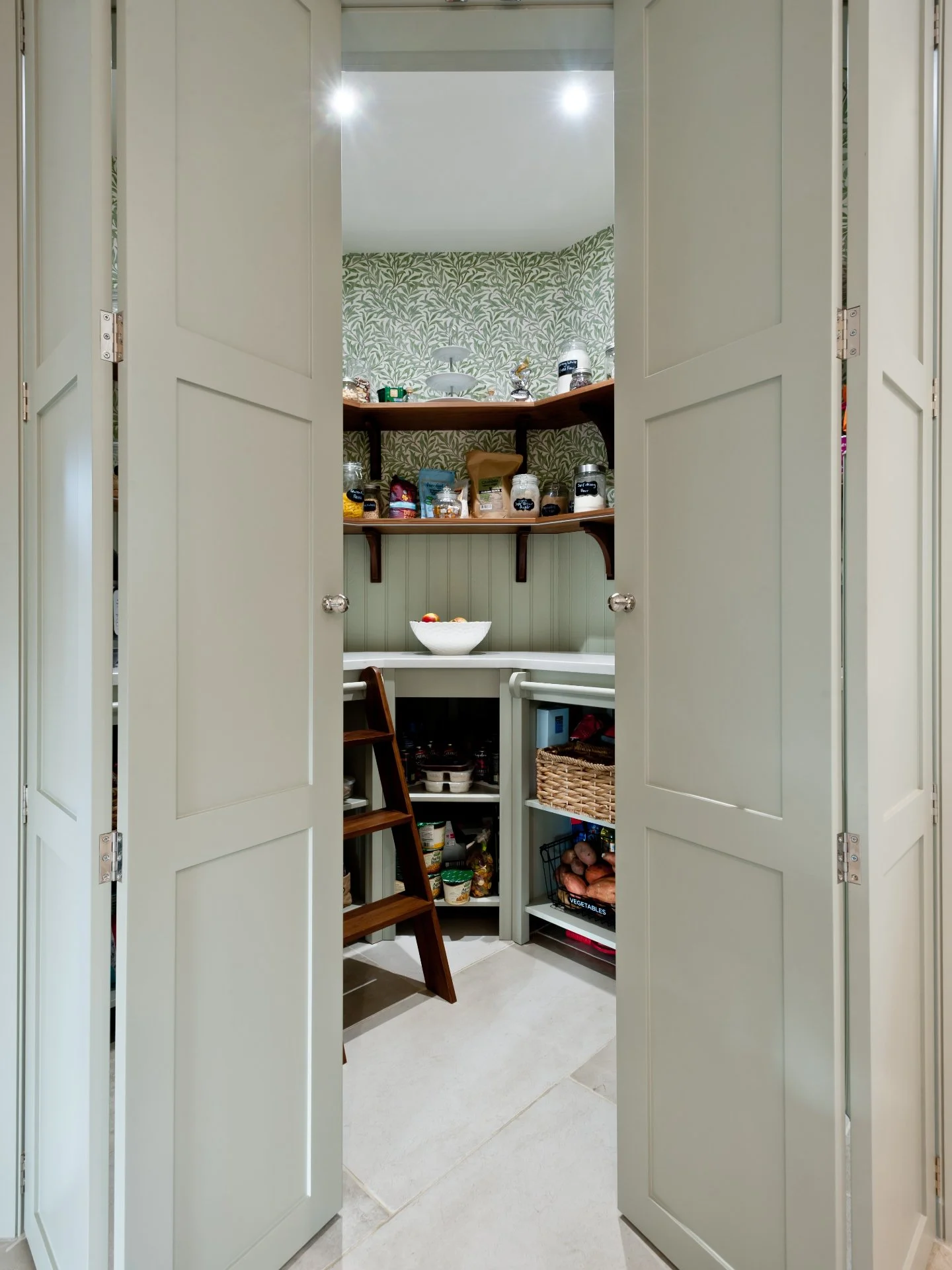 What is your dream kitchen feature?

My must-have is my hot water tap.
My dream - a walk-in pantry. 

Like this one. Beautifully crafted shaker style bi-folding doors leading to an open-shelved pantry, making food prep a breeze - and, a lot of joy.

