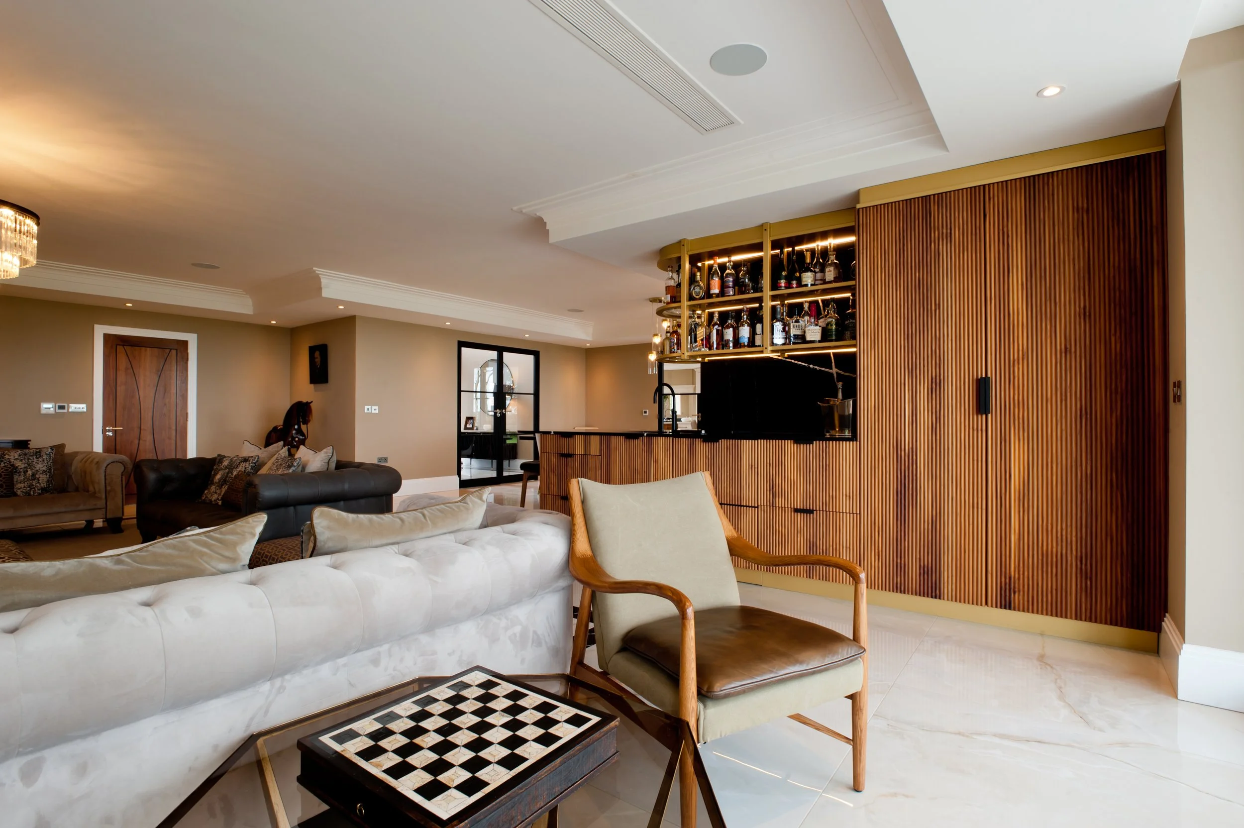 Raise the bar. A statement bespoke walnut home bar designed for entertaining in style.