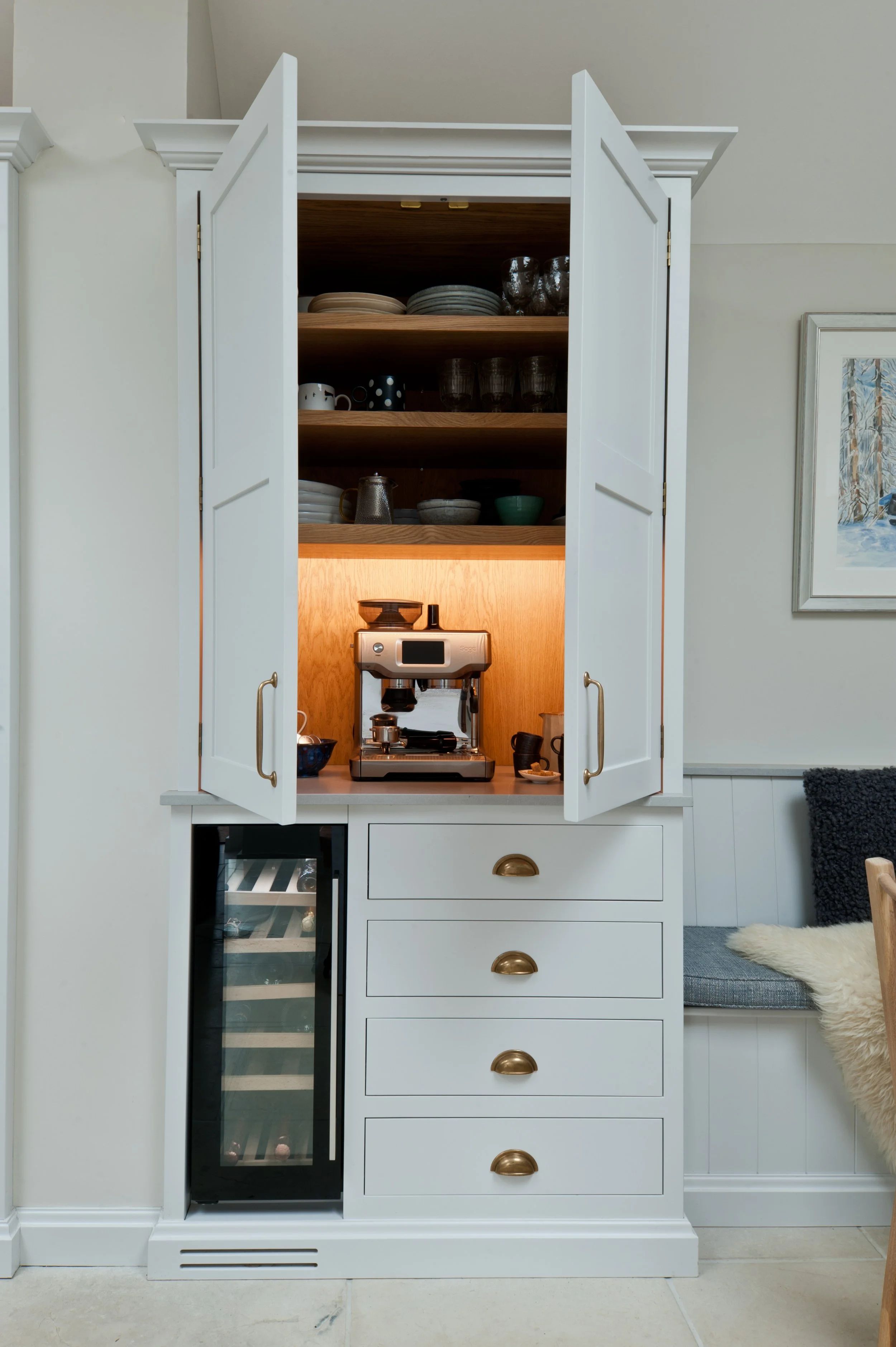 Bespoke breakfast cupboard with internal timber shelving, integrated storage and painted Shaker doors.