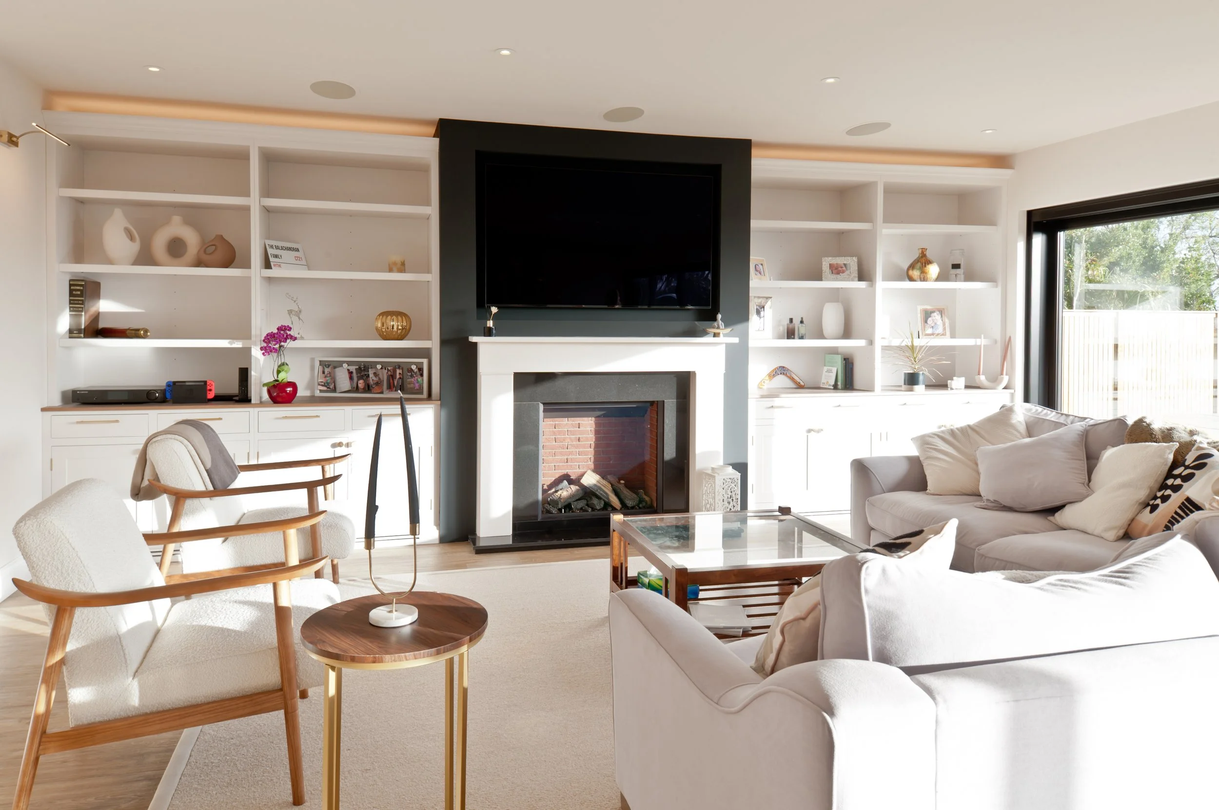 All work and plenty of play.
Bespoke living-room cabinetry bringing media, display, storage and a dedicated workspace together in one considered design.