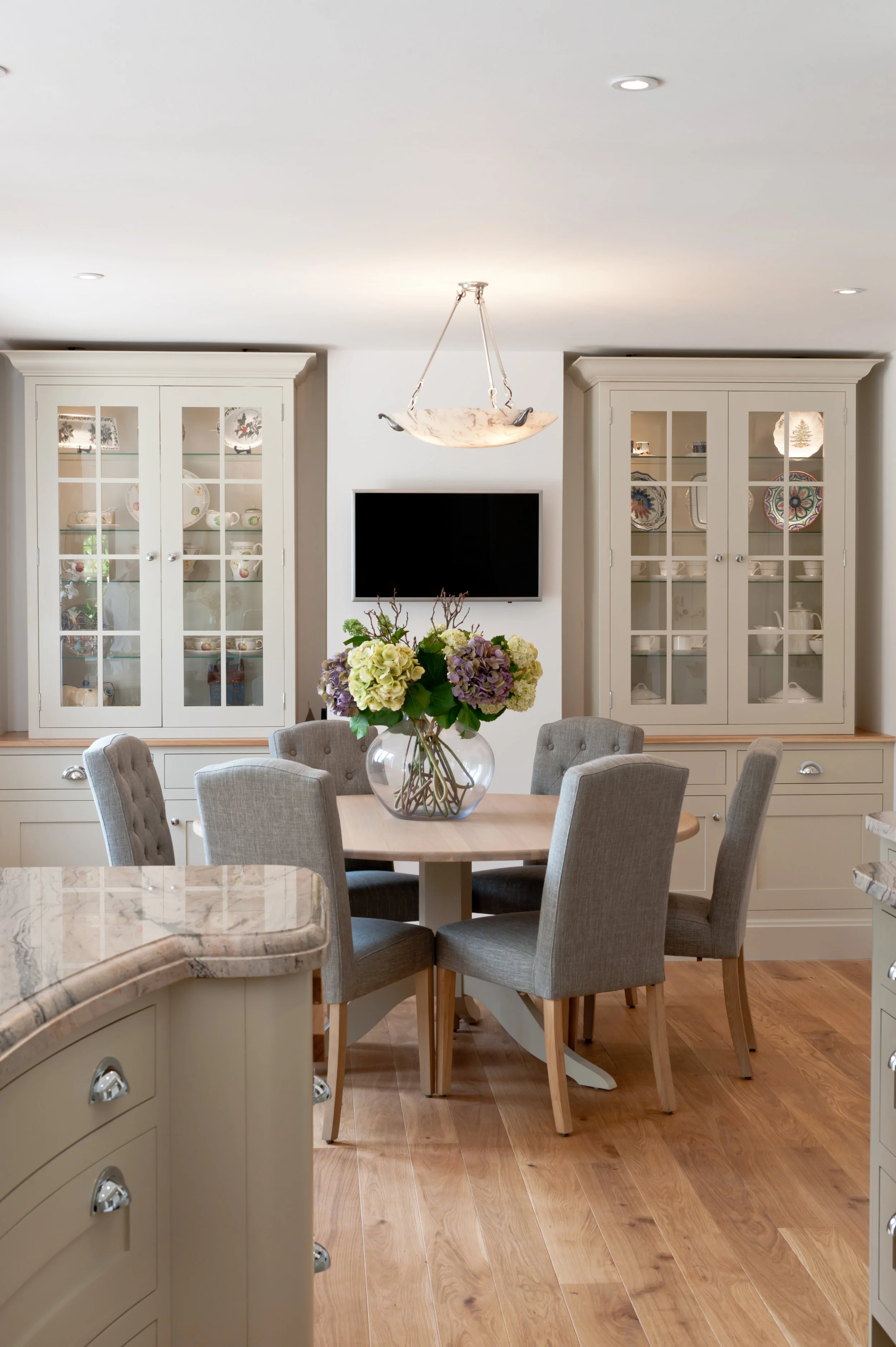 Room for one more. Bespoke dining room cabinetry combining display, storage and a beautifully considered backdrop for gathering.