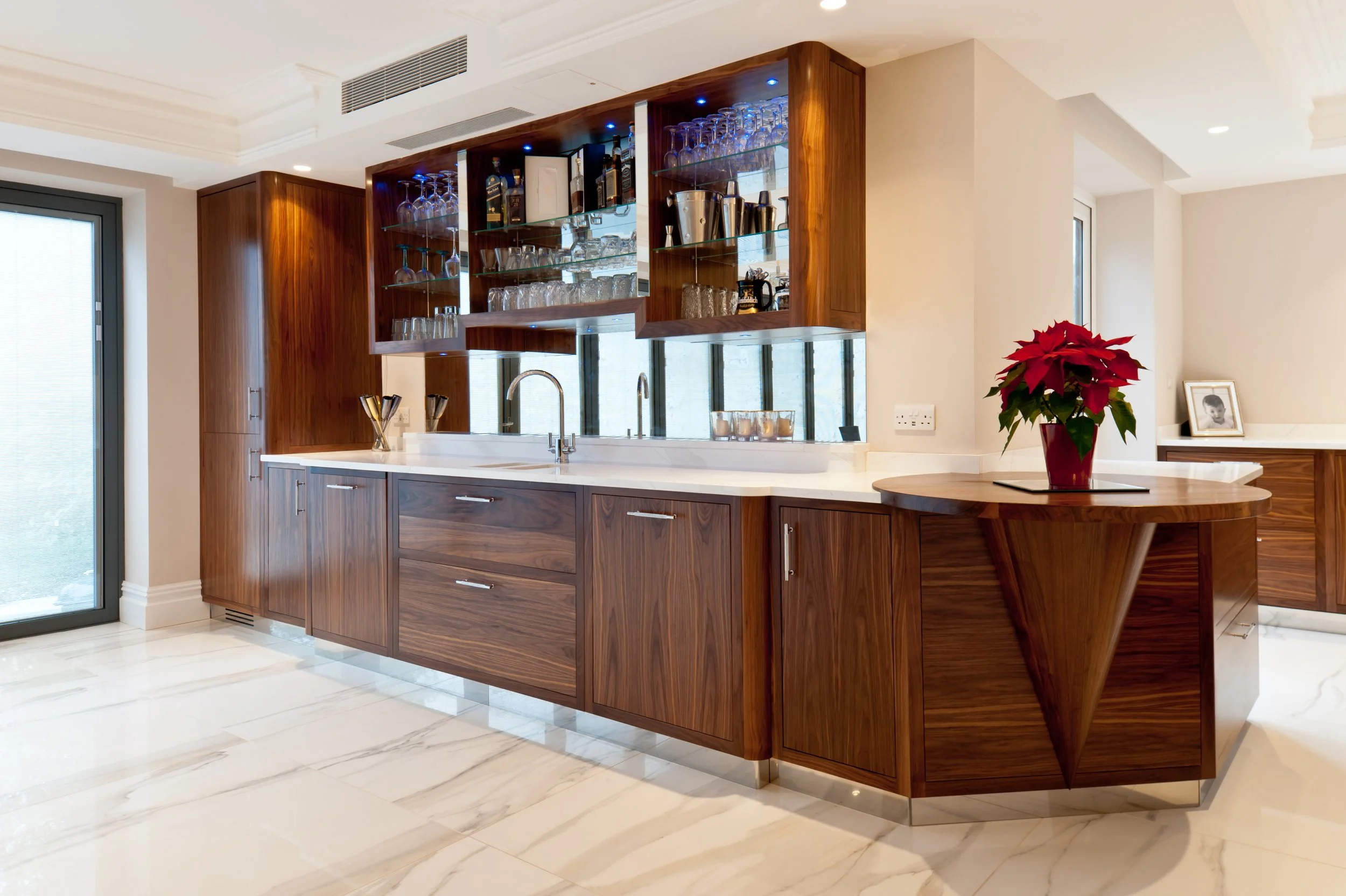 The main event. A substantial bespoke home bar designed around drinks, glassware and the art of entertaining.